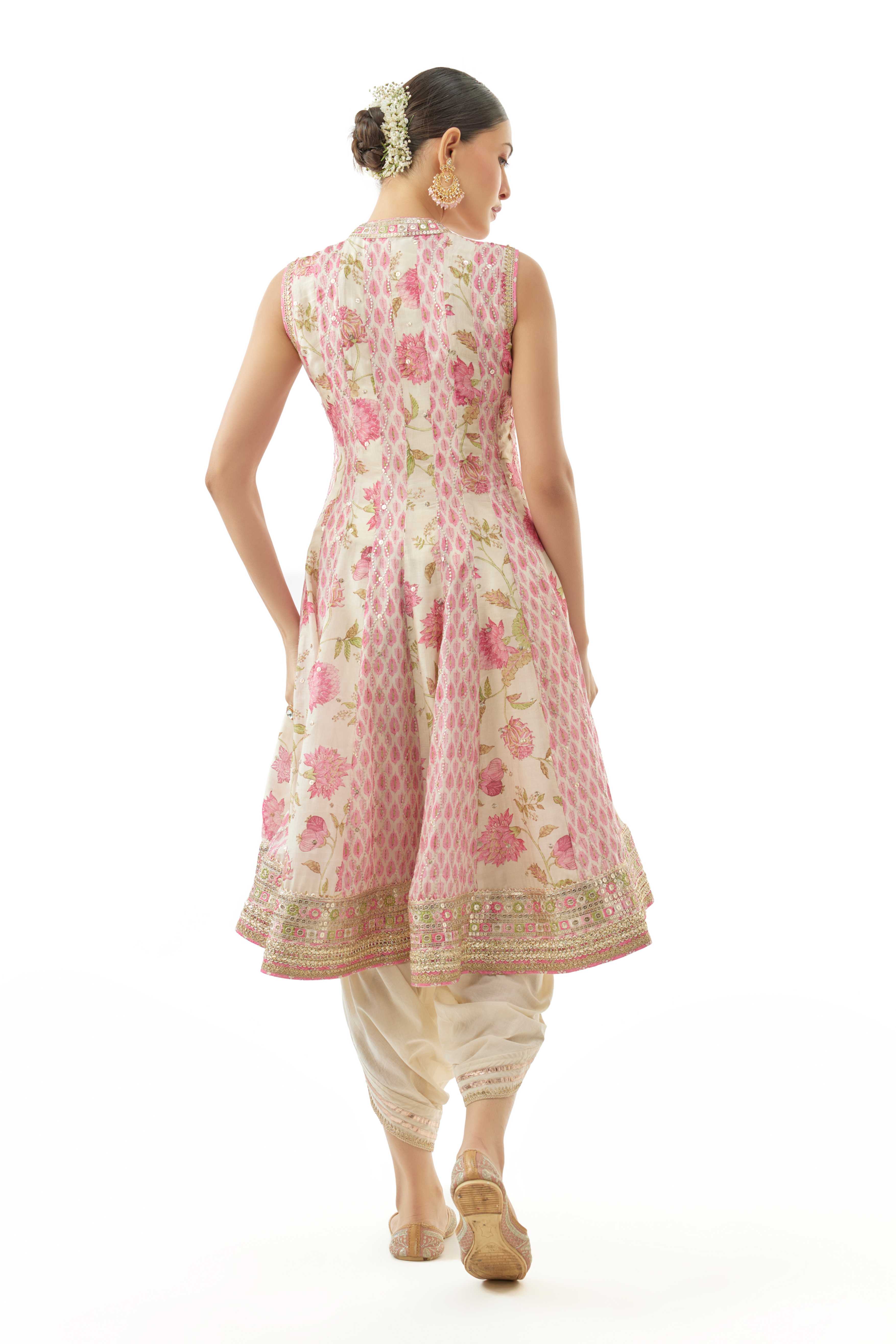 A model showcasing Smriti Ivory Dhoti Set by Gopi Vaid from Gopi Vaid's collection