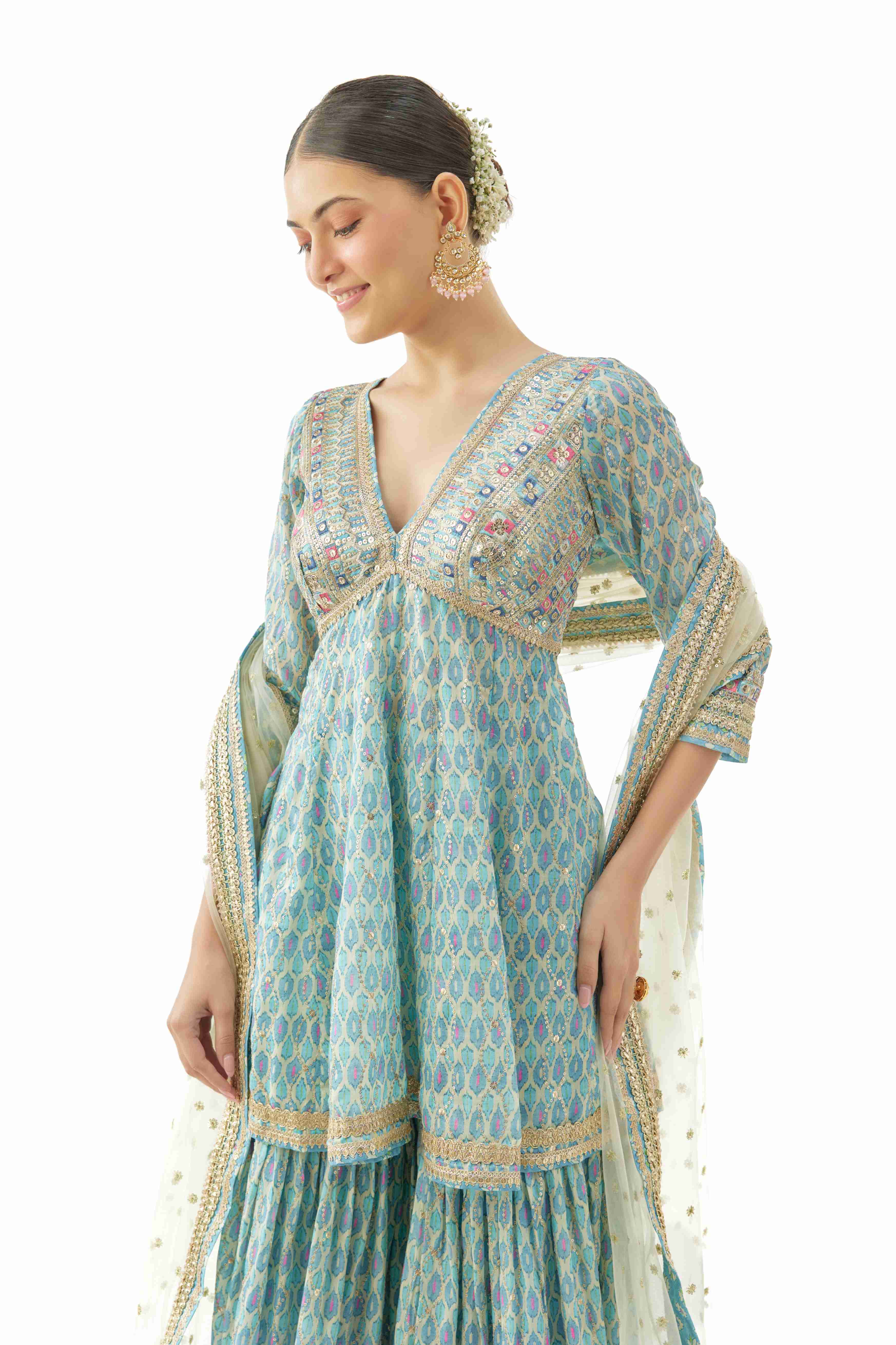 A model showcasing Tanvi Peplum Set by Gopi Vaid from Gopi Vaid's collection A model showcasing Tanvi Peplum Set by Gopi Vaid from Gopi Vaid's collection