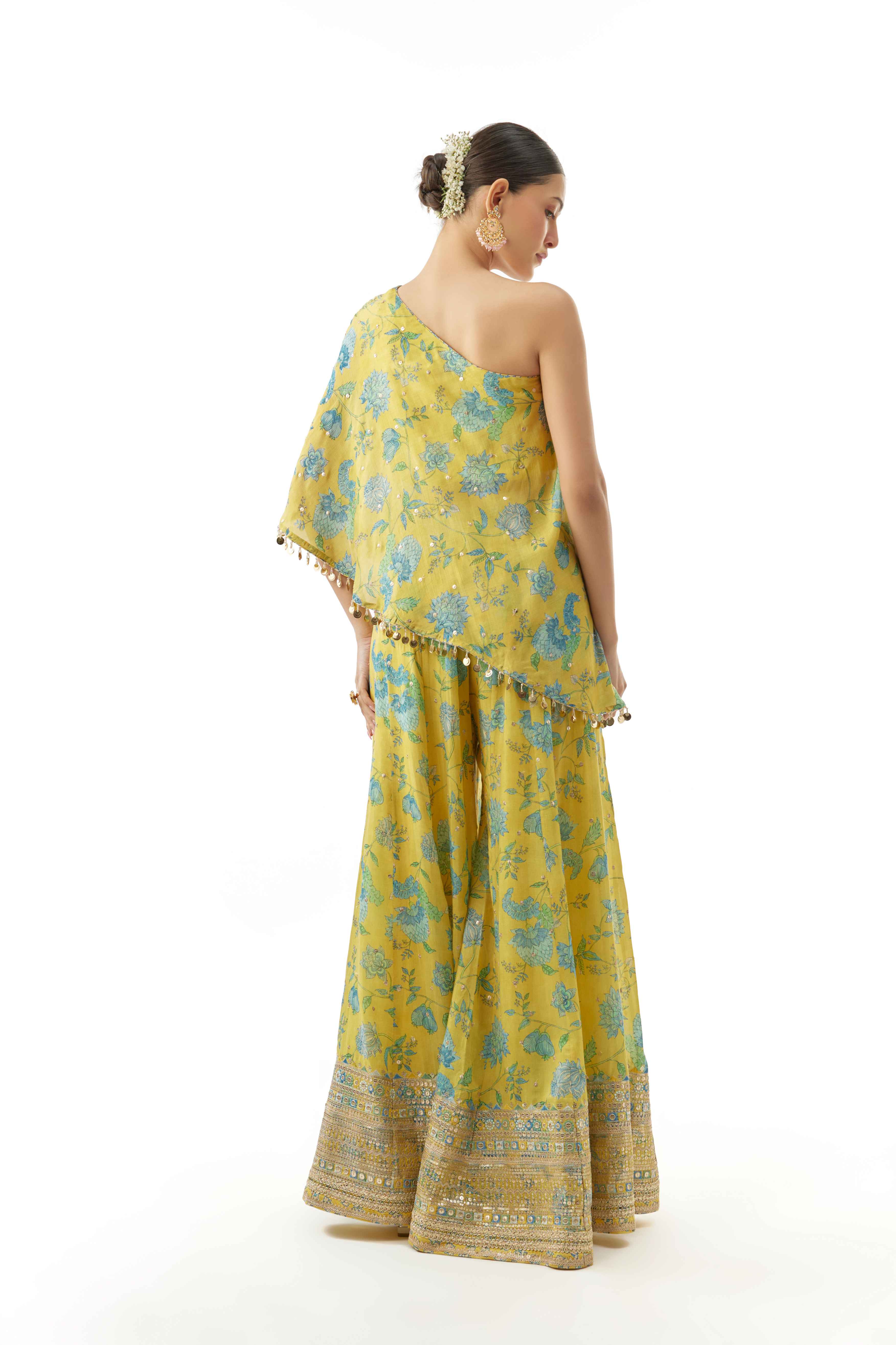 A model showcasing Vanshita One Shoulder Set by Gopi Vaid from Gopi Vaid's collection