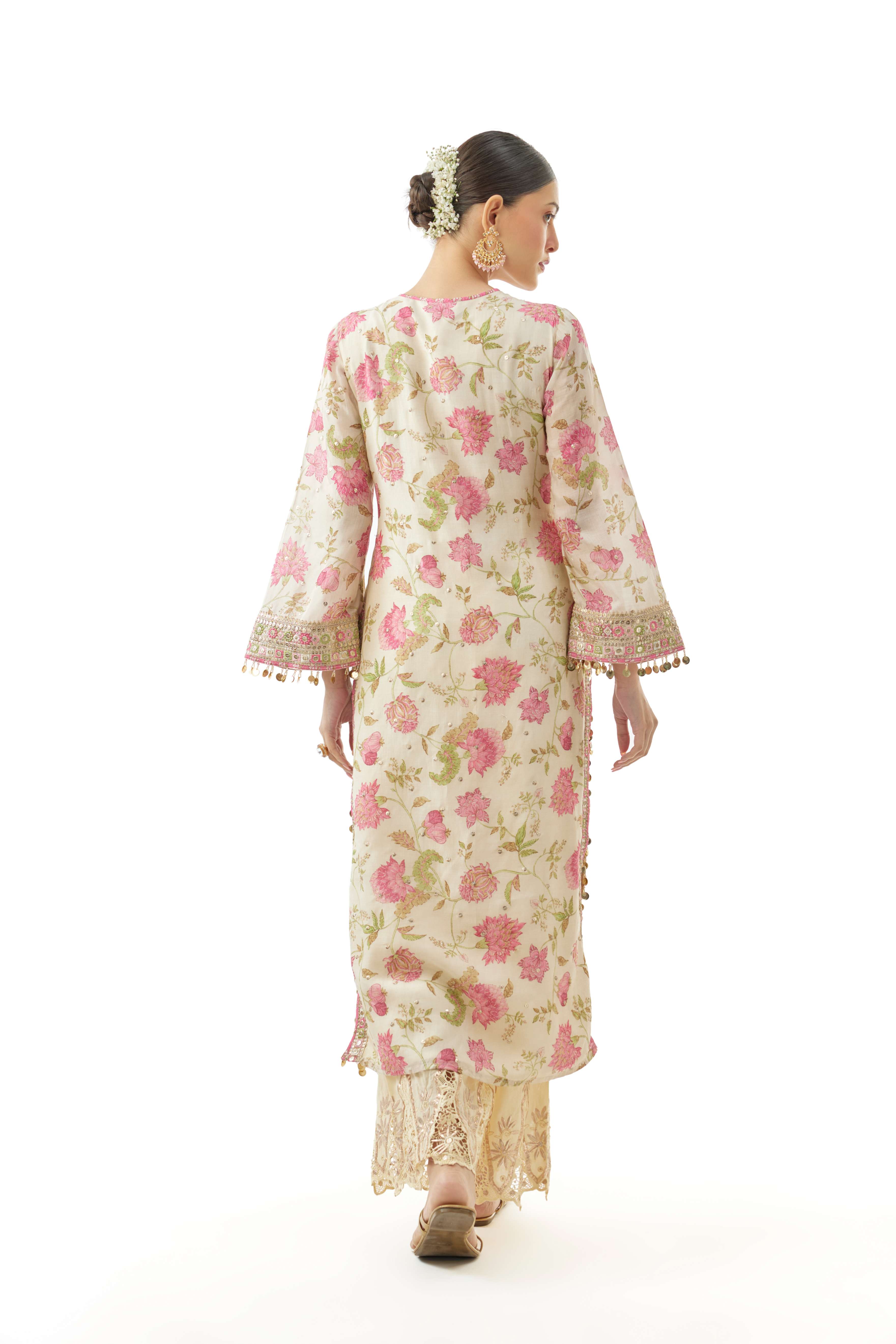 A model showcasing Kavya Ivory Tunic by Gopi Vaid from Gopi Vaid's collection