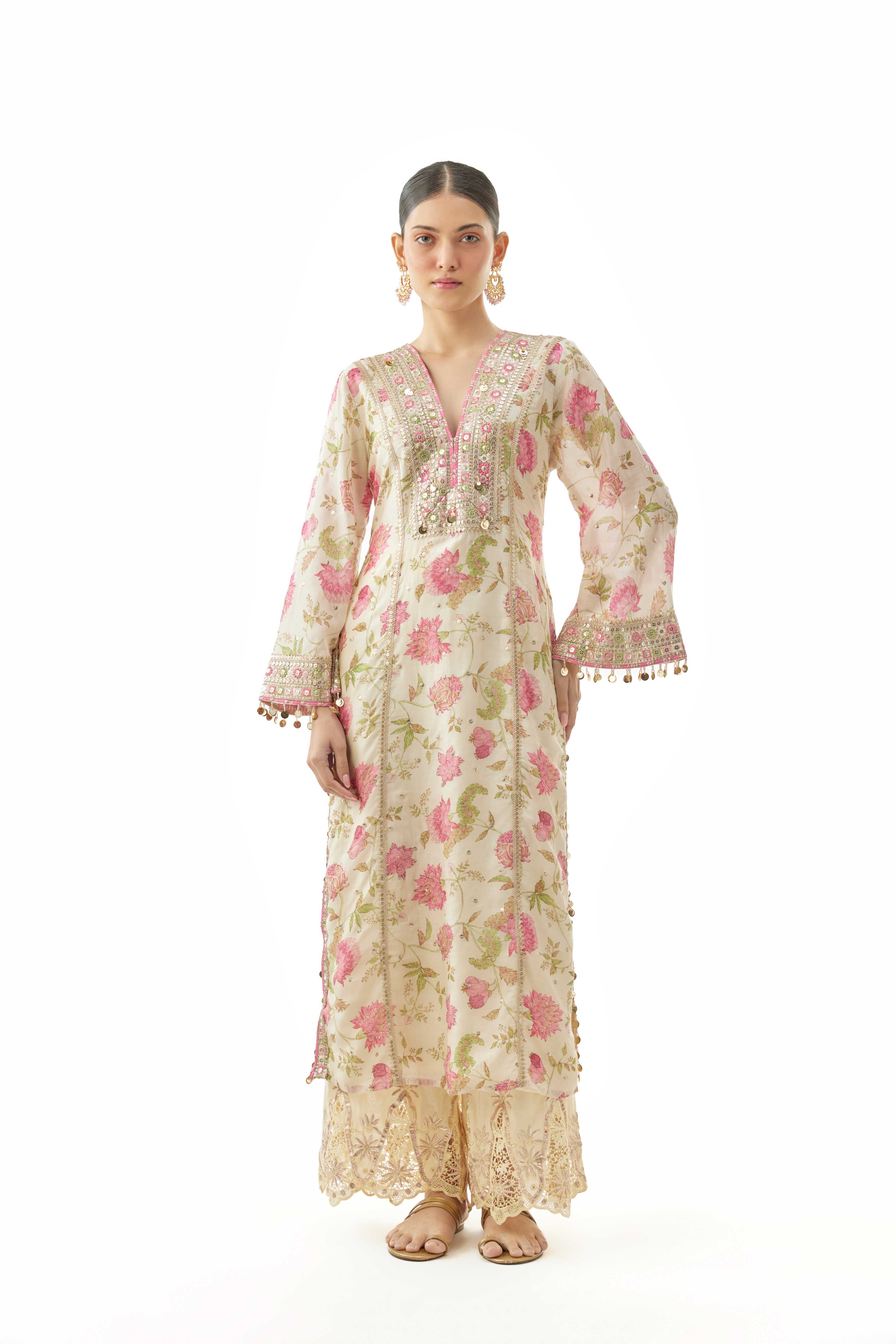 A model showcasing Kavya Ivory Tunic by Gopi Vaid from Gopi Vaid's collection