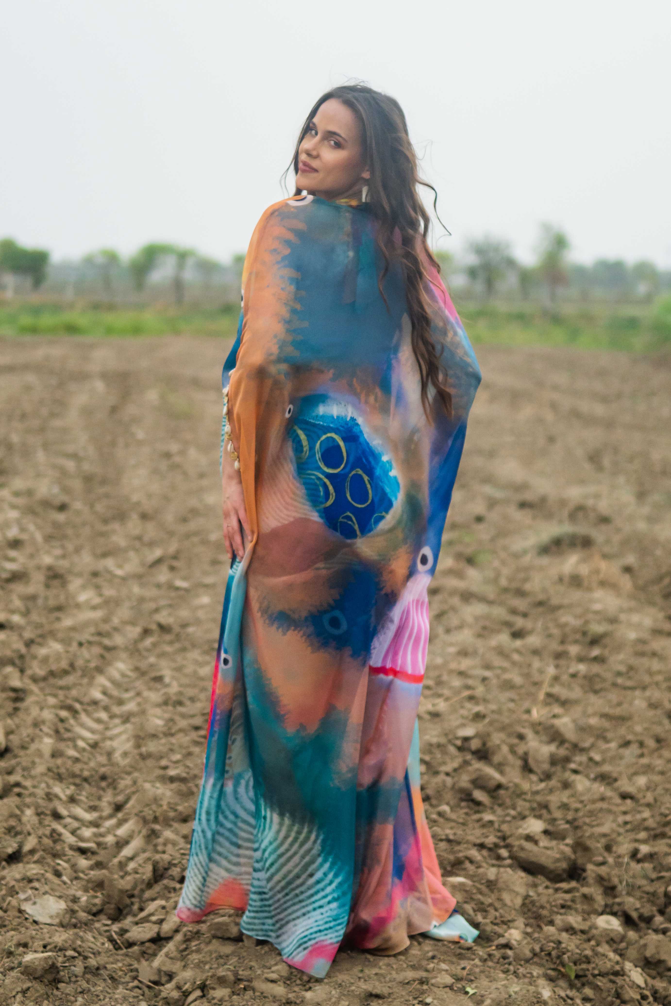 A model showcasing Boheme Daze Cape Set by Miku Kumar from Miku Kumar's collection