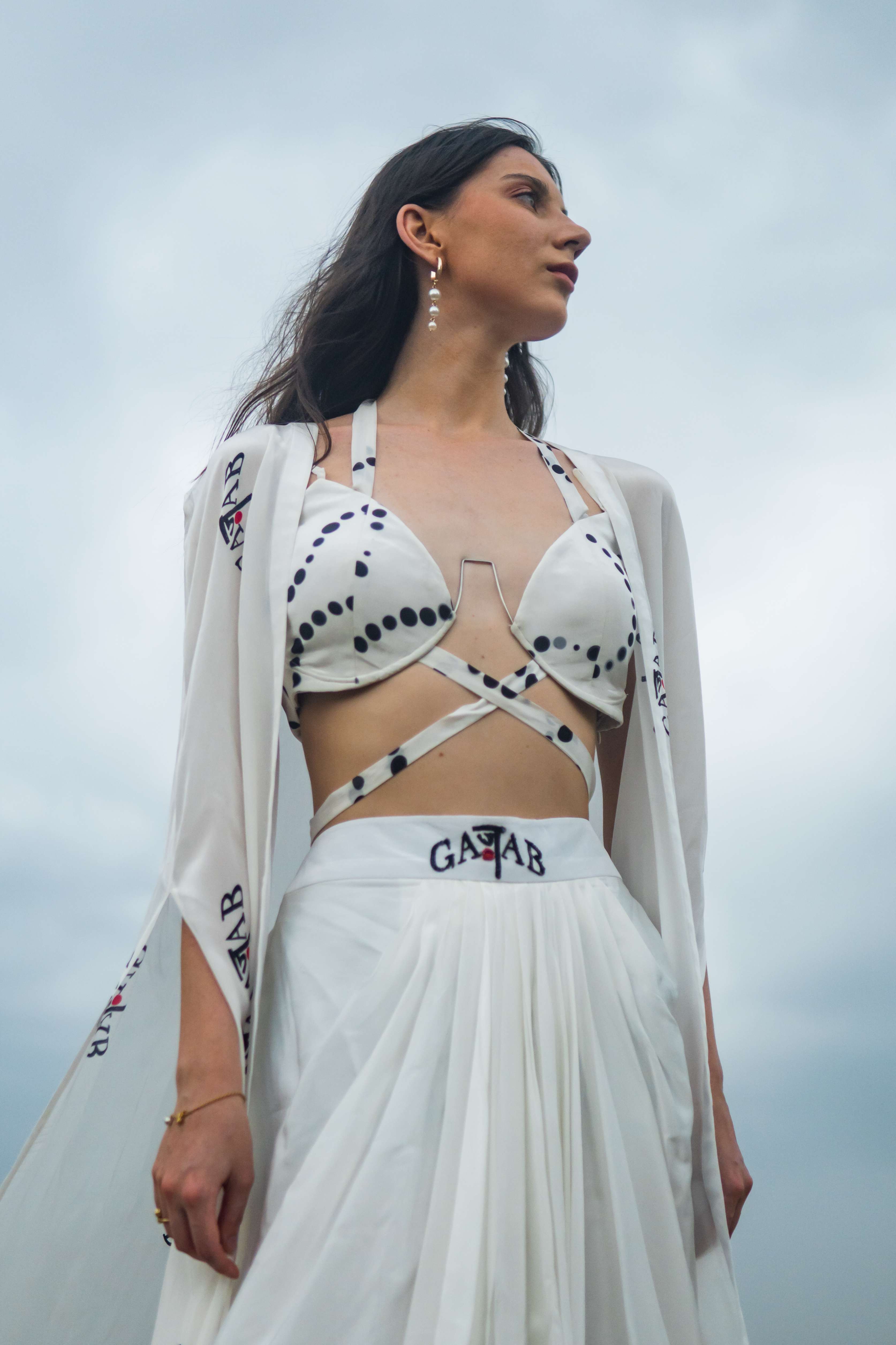 A model showcasing Soul Caravan Cape Set by Miku Kumar from Miku Kumar's collection