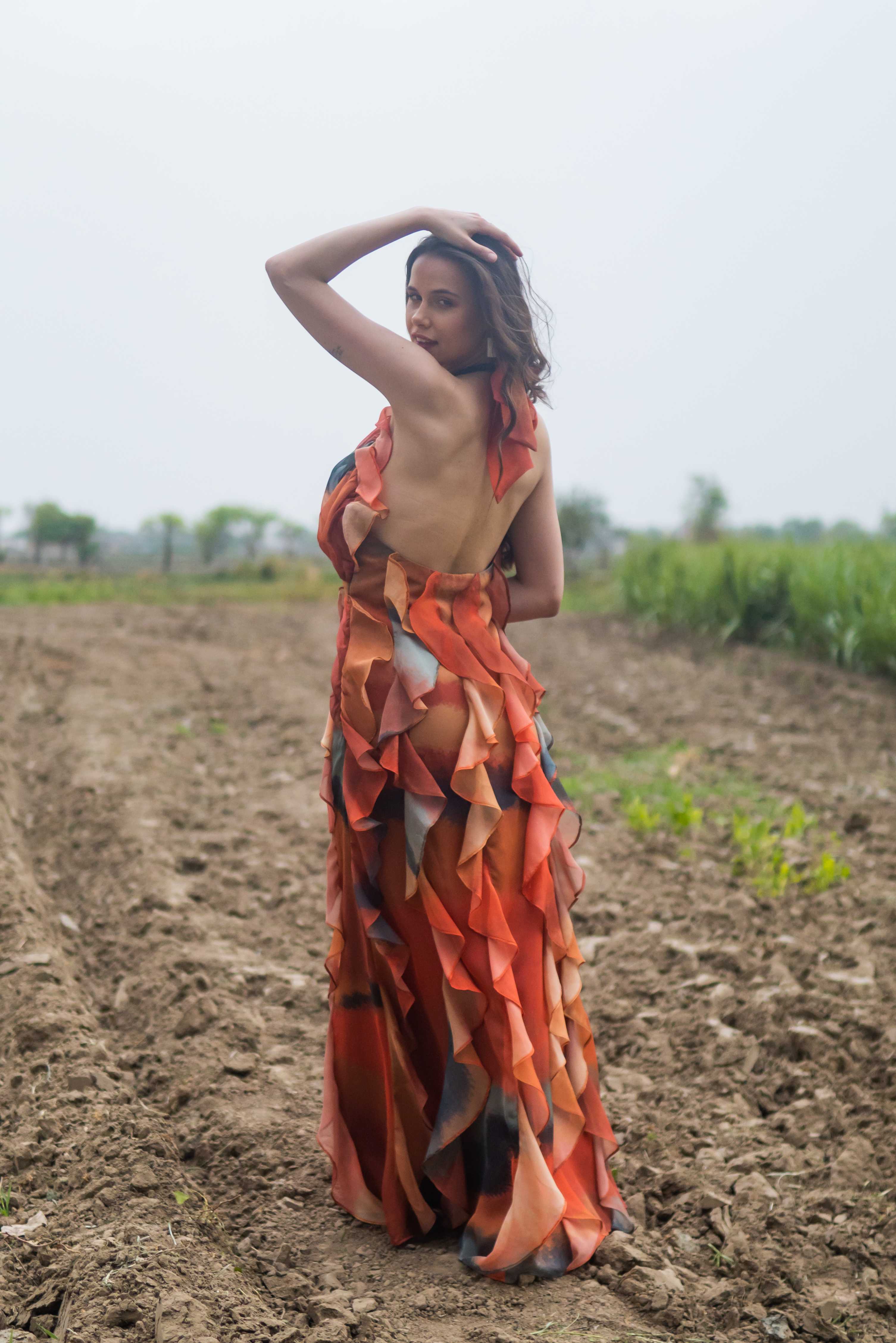 A model showcasing Sunflare Soul Maxi Dress by Miku Kumar from Miku Kumar's collection