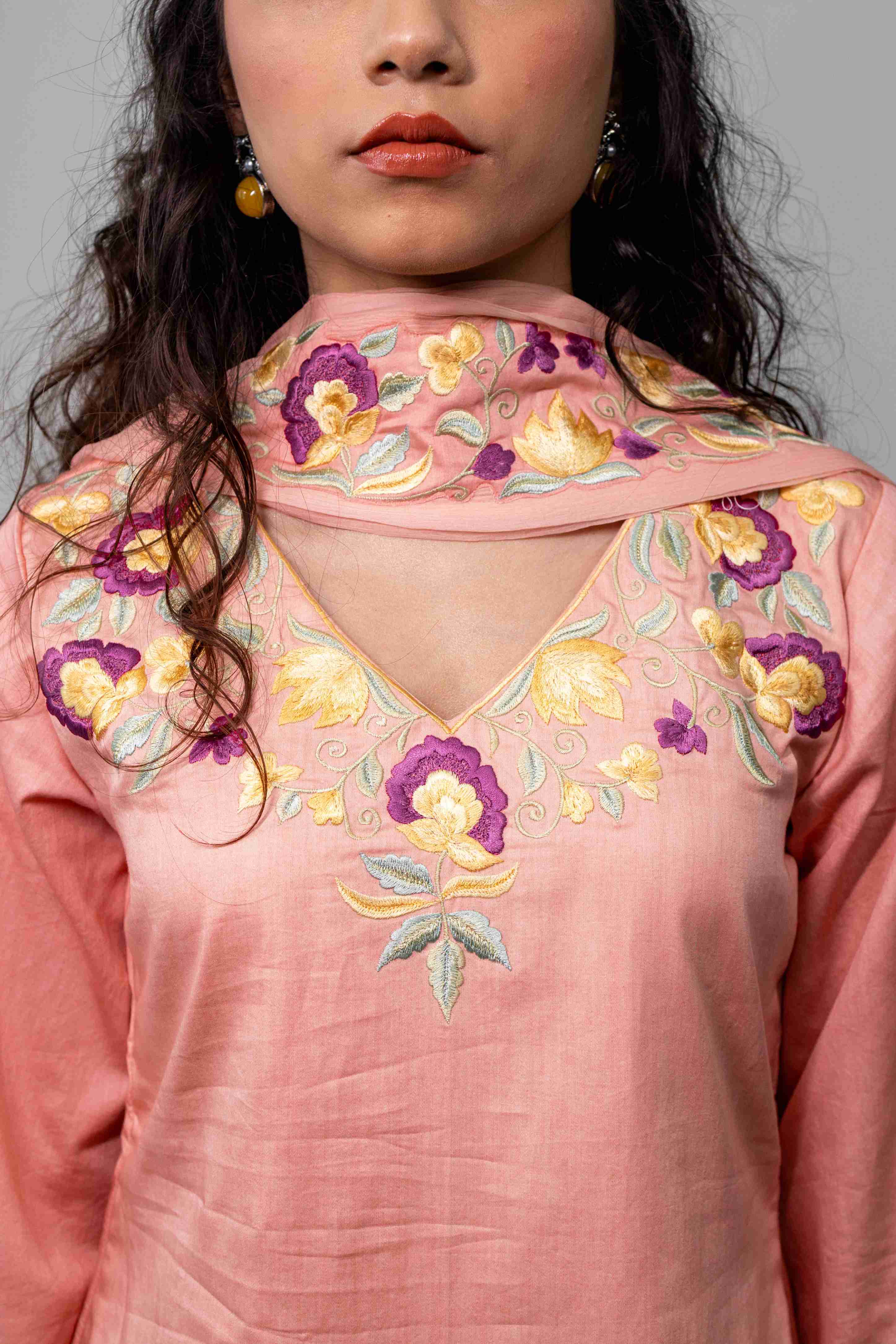 A model showcasing Kamal Coral Farshi Salwar Set by Gaamya from Gaamya's collection