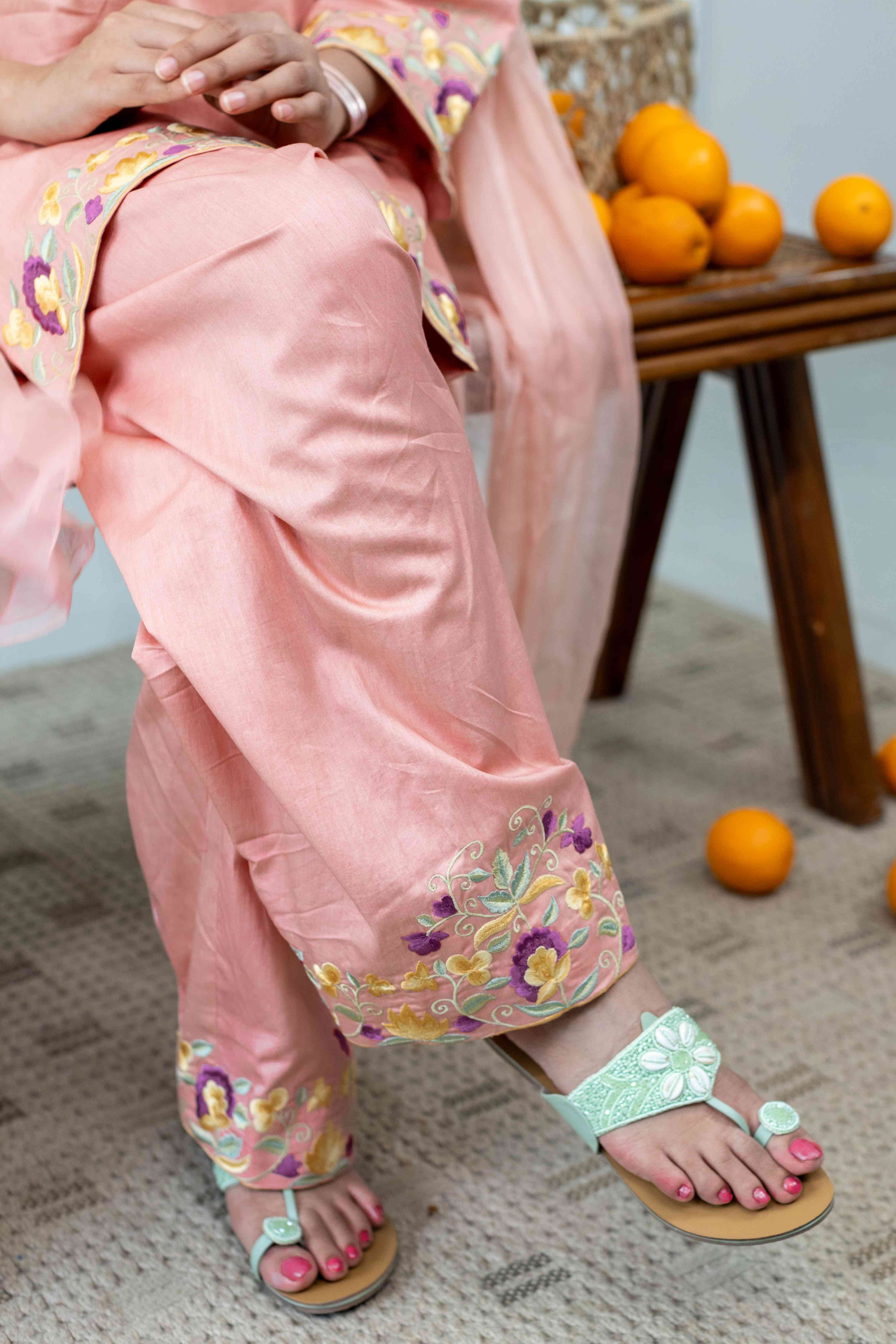 A model showcasing Kamal Coral Farshi Salwar Set by Gaamya from Gaamya's collection