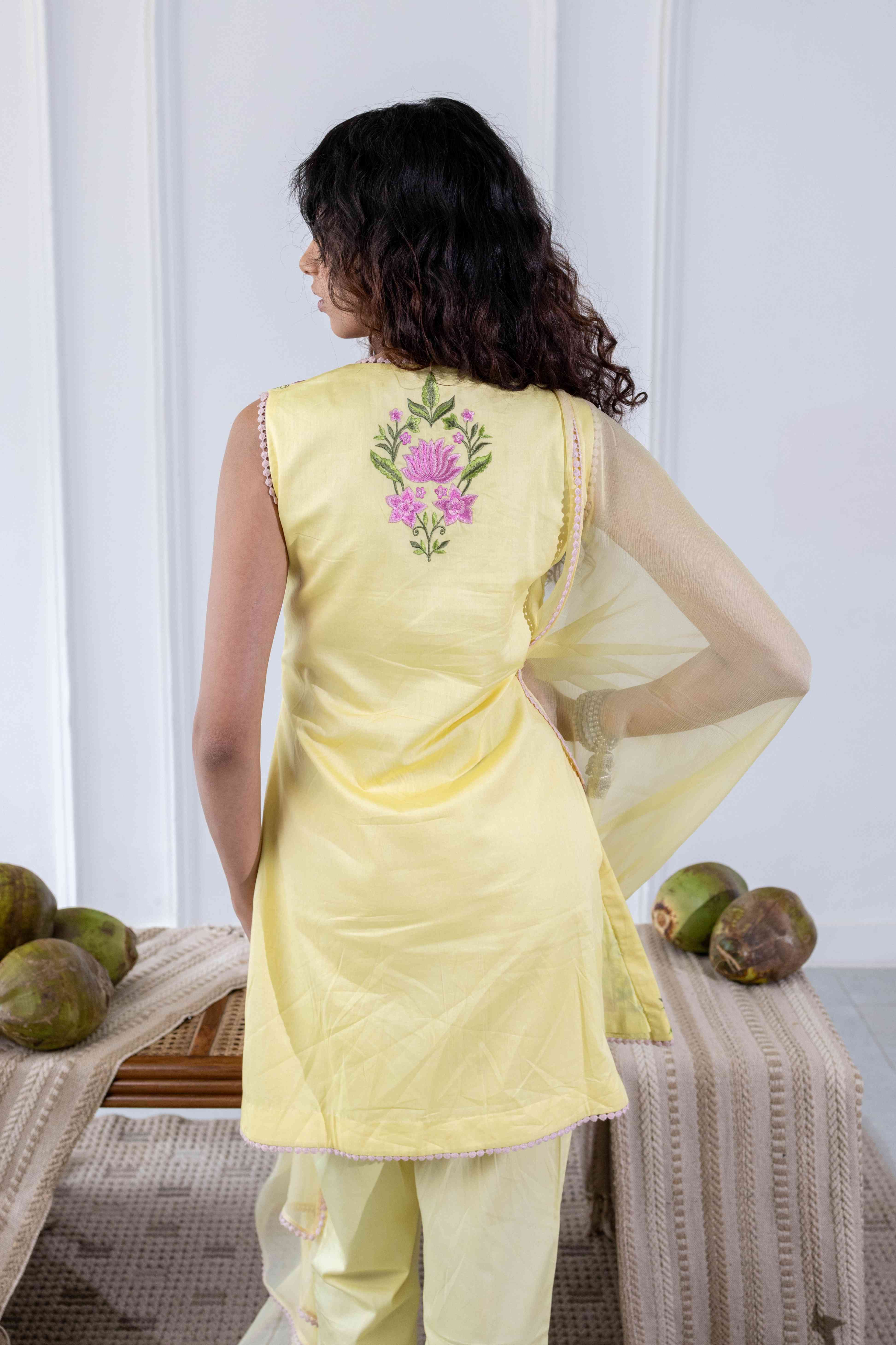 A model showcasing Surajmukhi Yellow Kurta Suit by Gaamya from Gaamya's collection