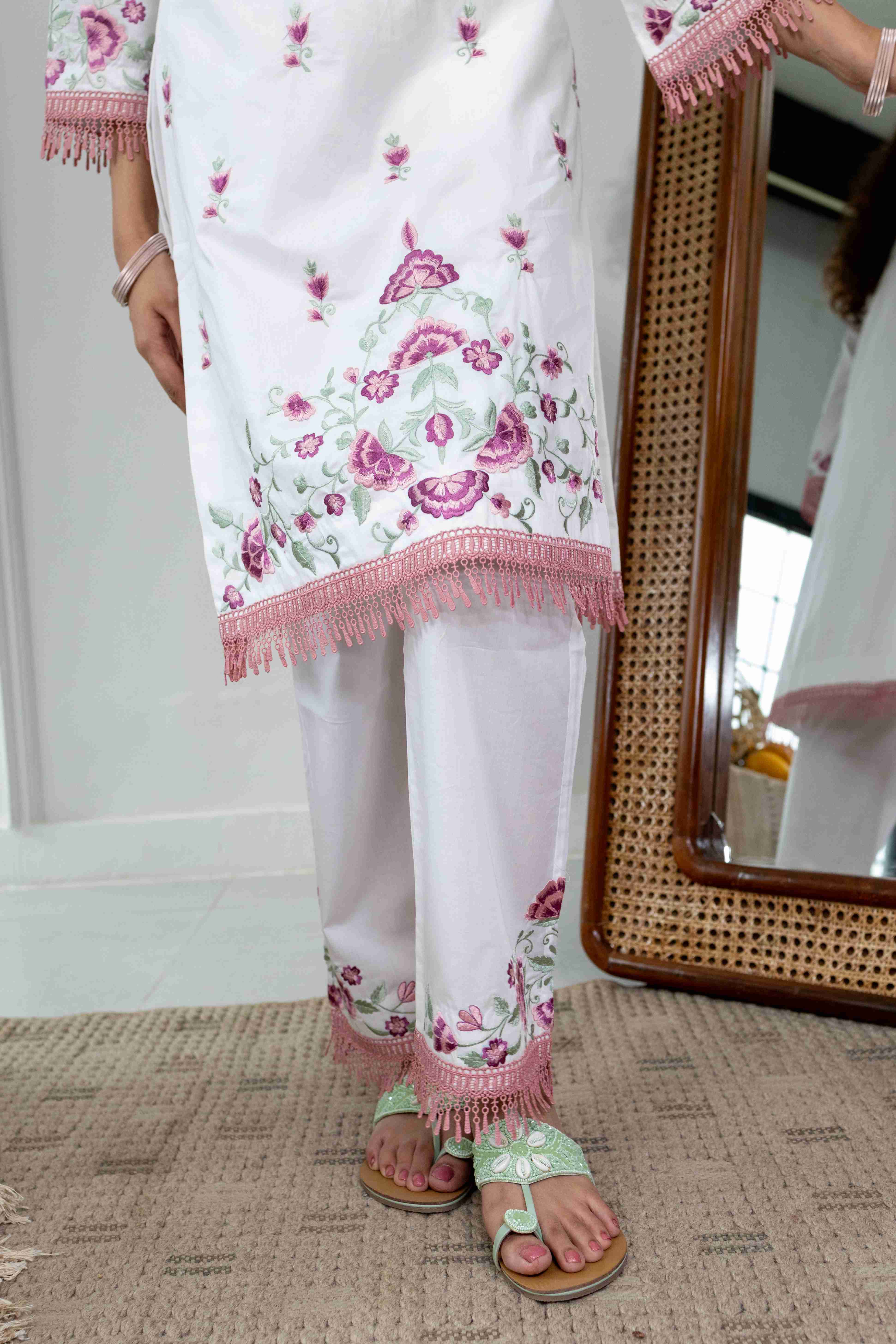 A model showcasing Palash White Pink Kurta Set by Gaamya from Gaamya's collection