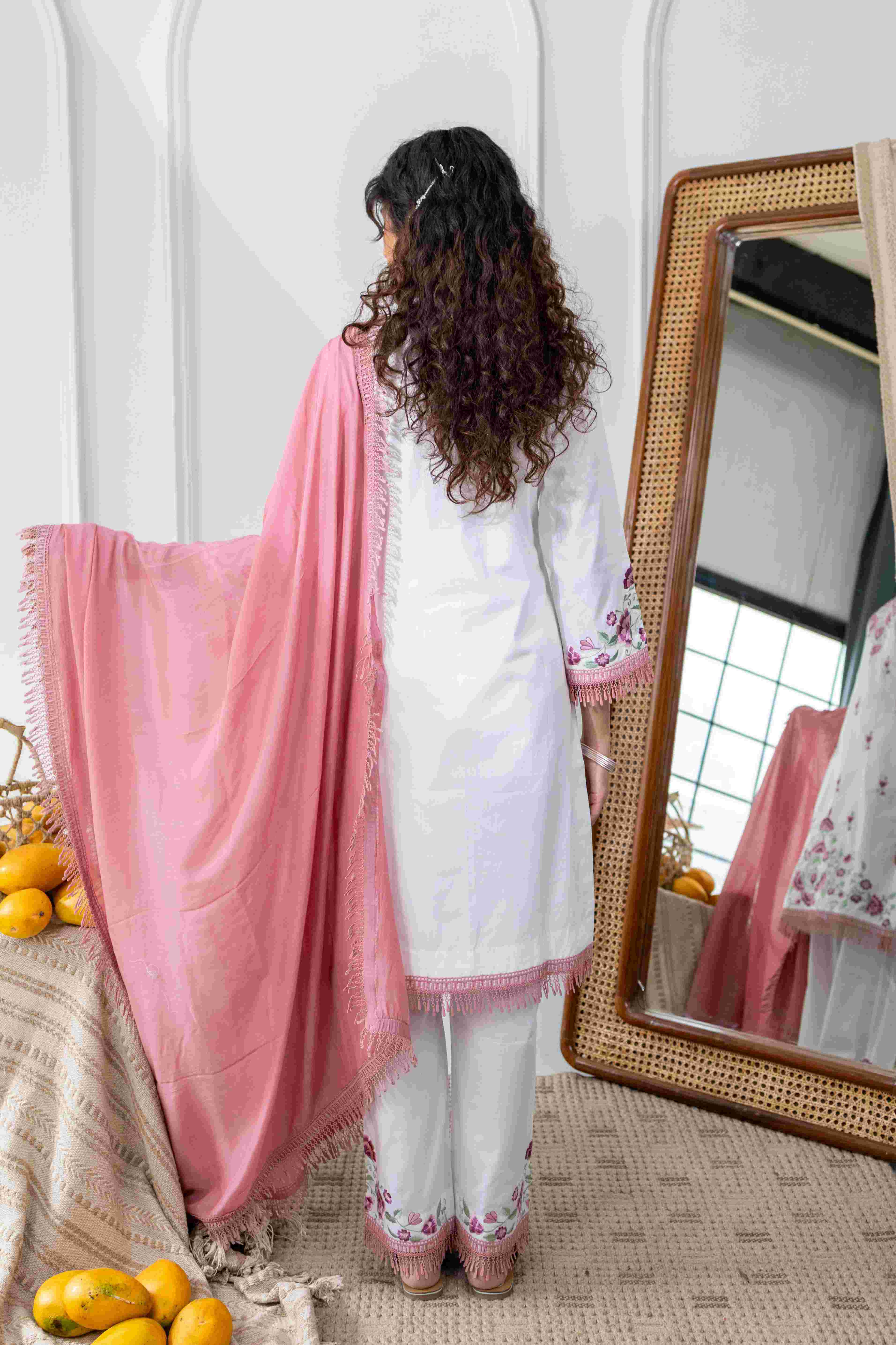 A model showcasing Palash White Pink Kurta Set by Gaamya from Gaamya's collection