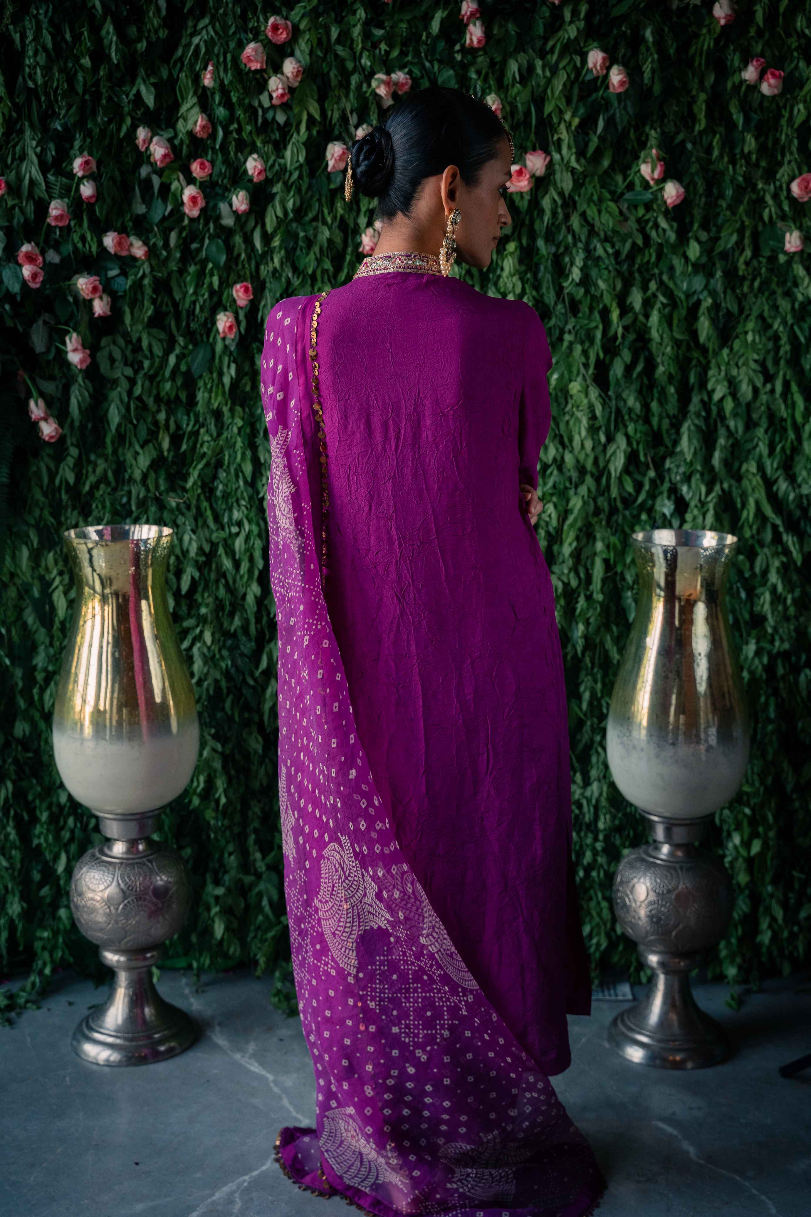 A model showcasing Purple Leheriya Kurta Set by Pooja Singhal from Pooja Singhal's collection