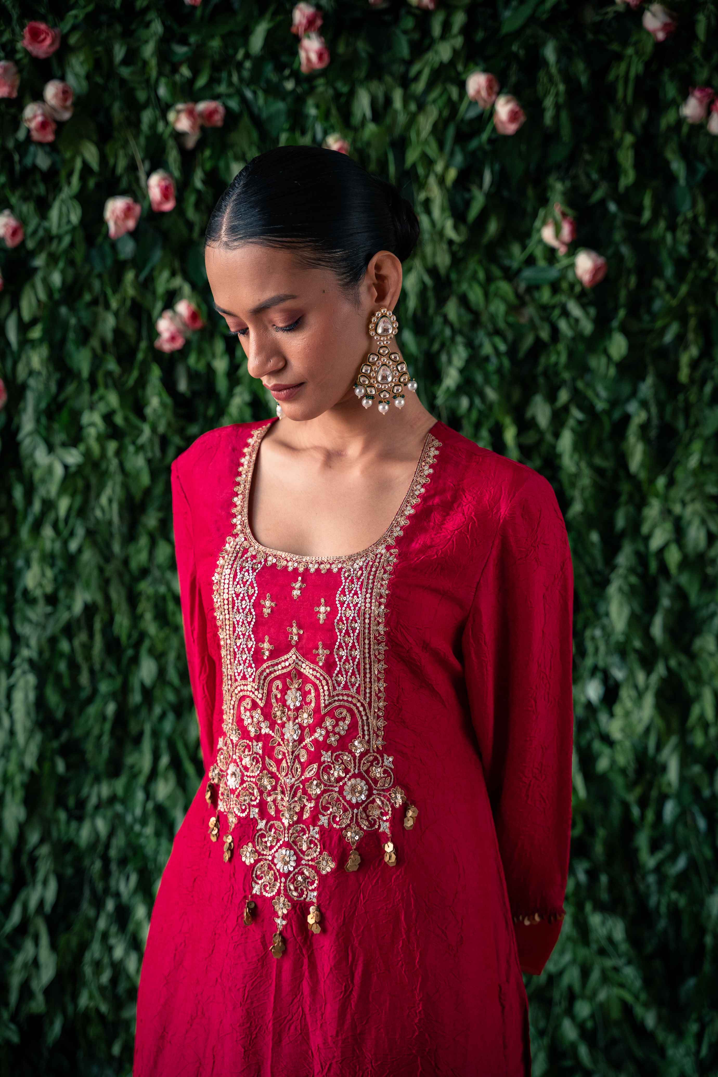 A model showcasing Coral Embroidered Crushed Silk Kurta Set by Pooja Singhal from Pooja Singhal's collection
