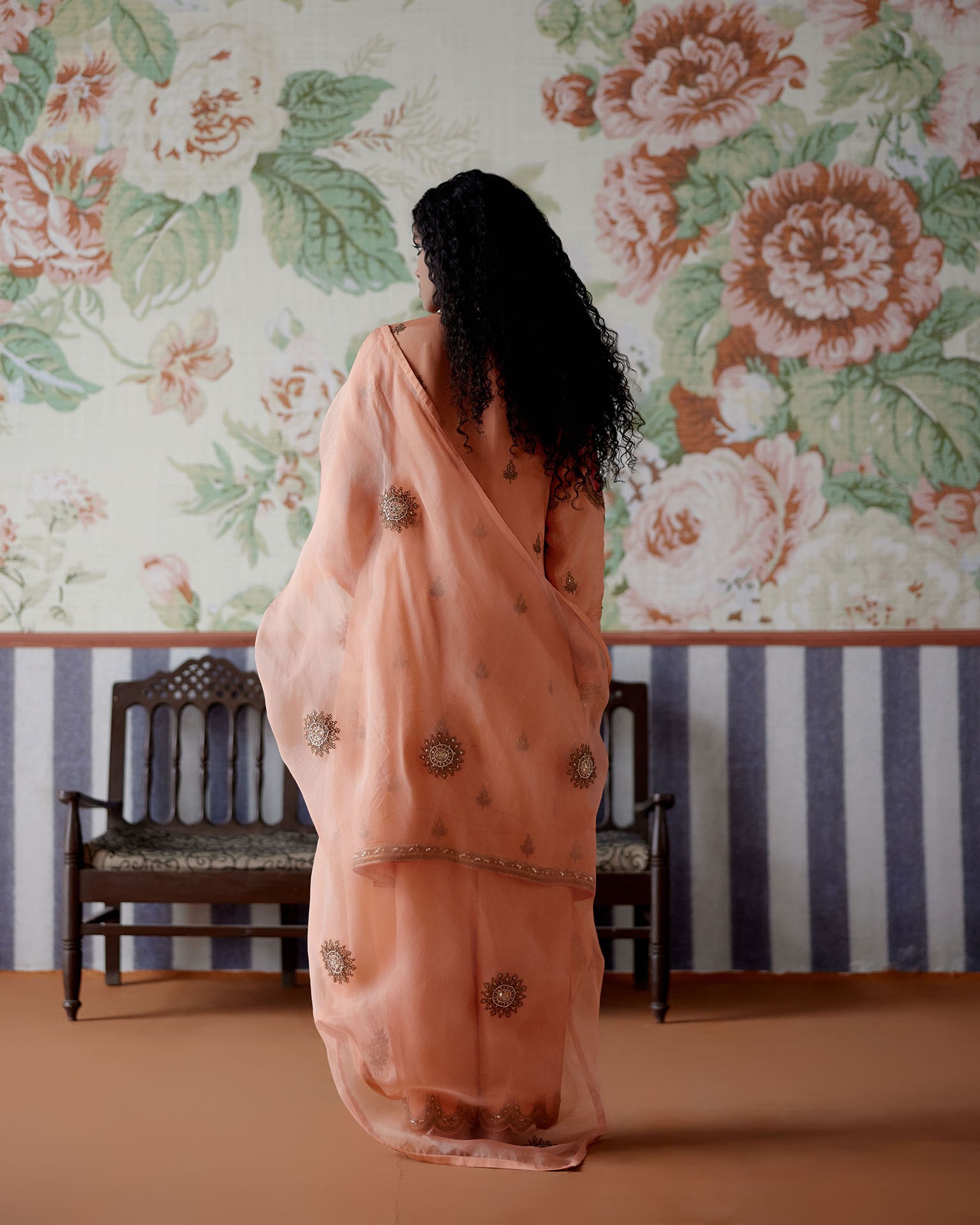 A model showcasing Peach Embroidered Kurta Set by Pooja Singhal from Pooja Singhal's collection