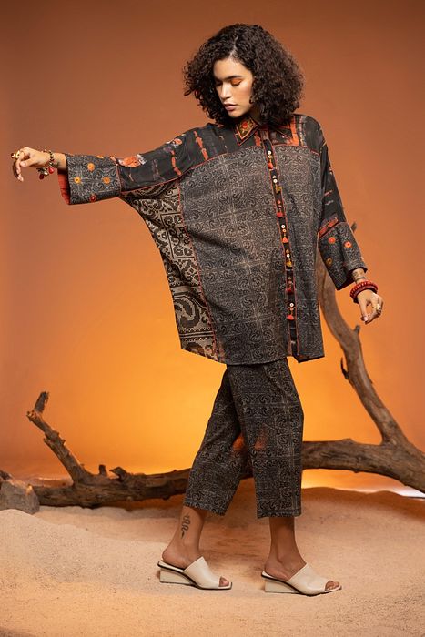 A model showcasing Black Sheesham Shirt by Capisvirleo from Capisvirleo's collection
