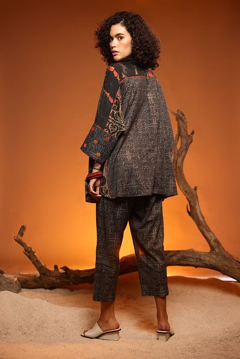 A model showcasing Black Sheesham Shirt by Capisvirleo from Capisvirleo's collection
