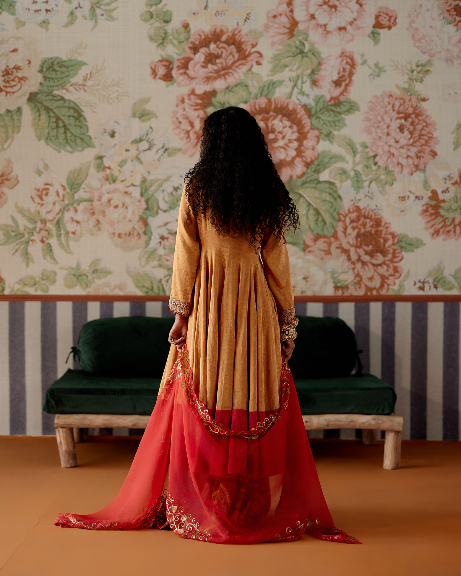 A model showcasing Orange Anarkali And Sharara Set by Pooja Singhal from Pooja Singhal's collection