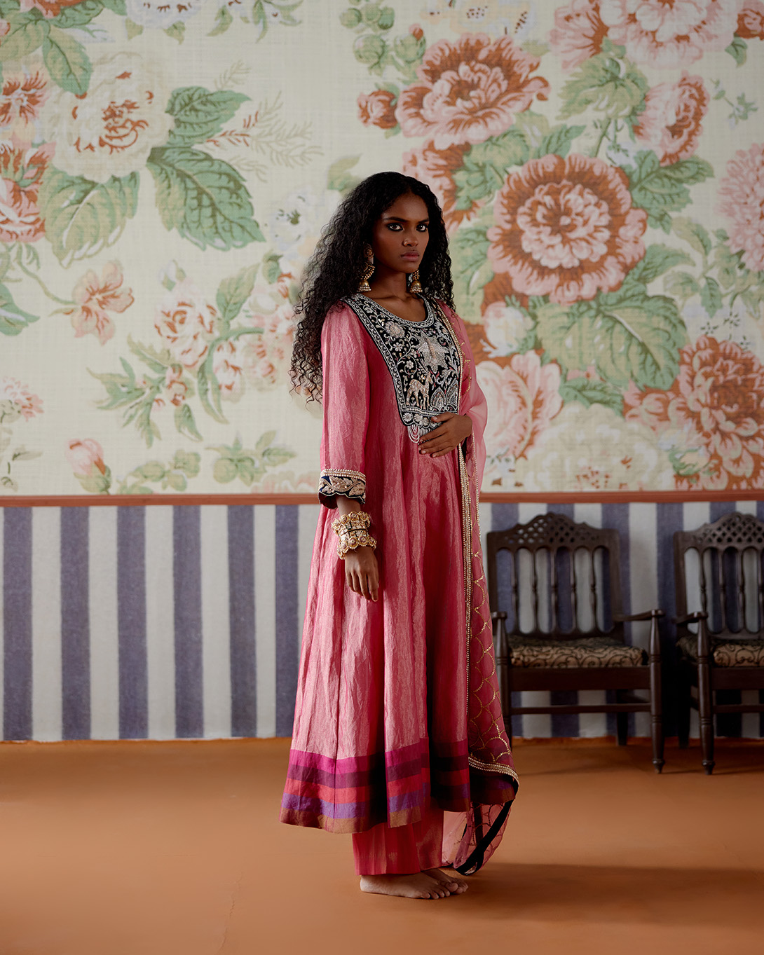 A model showcasing Pink Tissue And Velvet Anarkali Set by Pooja Singhal from Pooja Singhal's collection