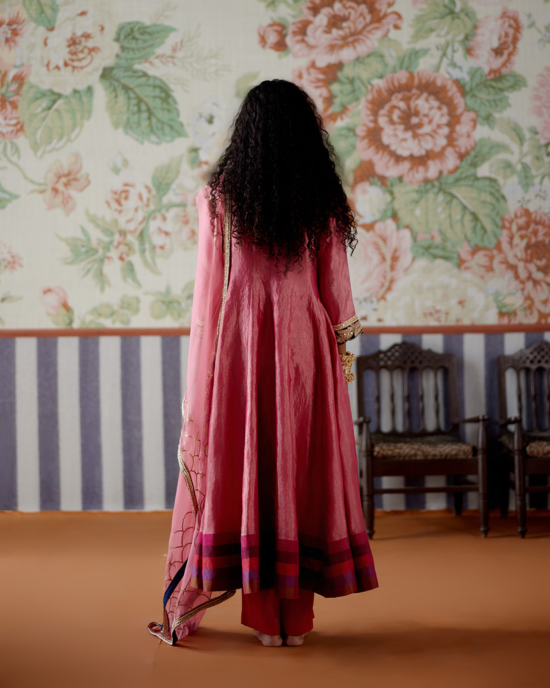 A model showcasing Pink Tissue And Velvet Anarkali Set by Pooja Singhal from Pooja Singhal's collection