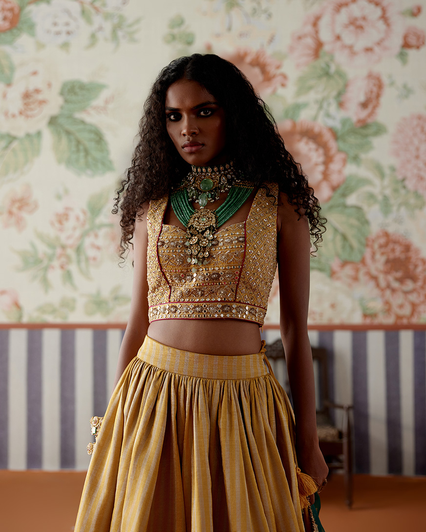 A model showcasing Yellow Gold Lehenga Set by Pooja Singhal from Pooja Singhal's collection