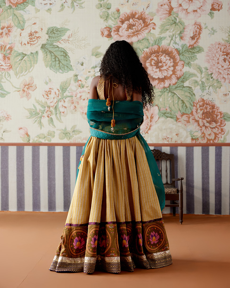 A model showcasing Yellow Gold Lehenga Set by Pooja Singhal from Pooja Singhal's collection