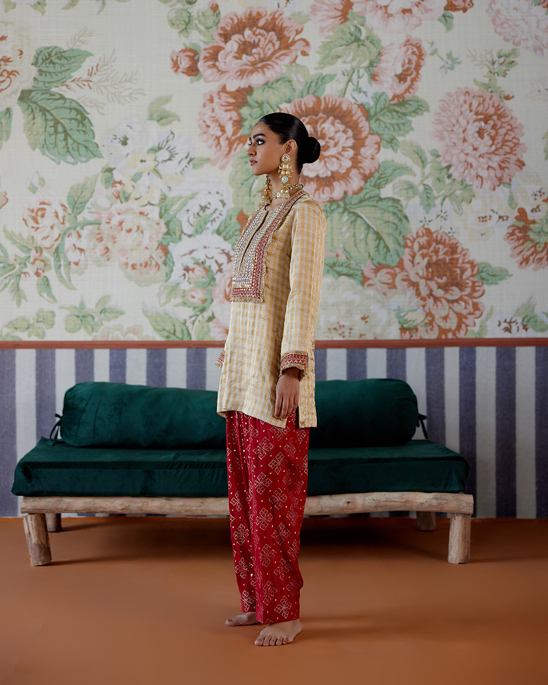 A model showcasing Gold And Red Kurta With Dhoti Pants by Pooja Singhal from Pooja Singhal's collection