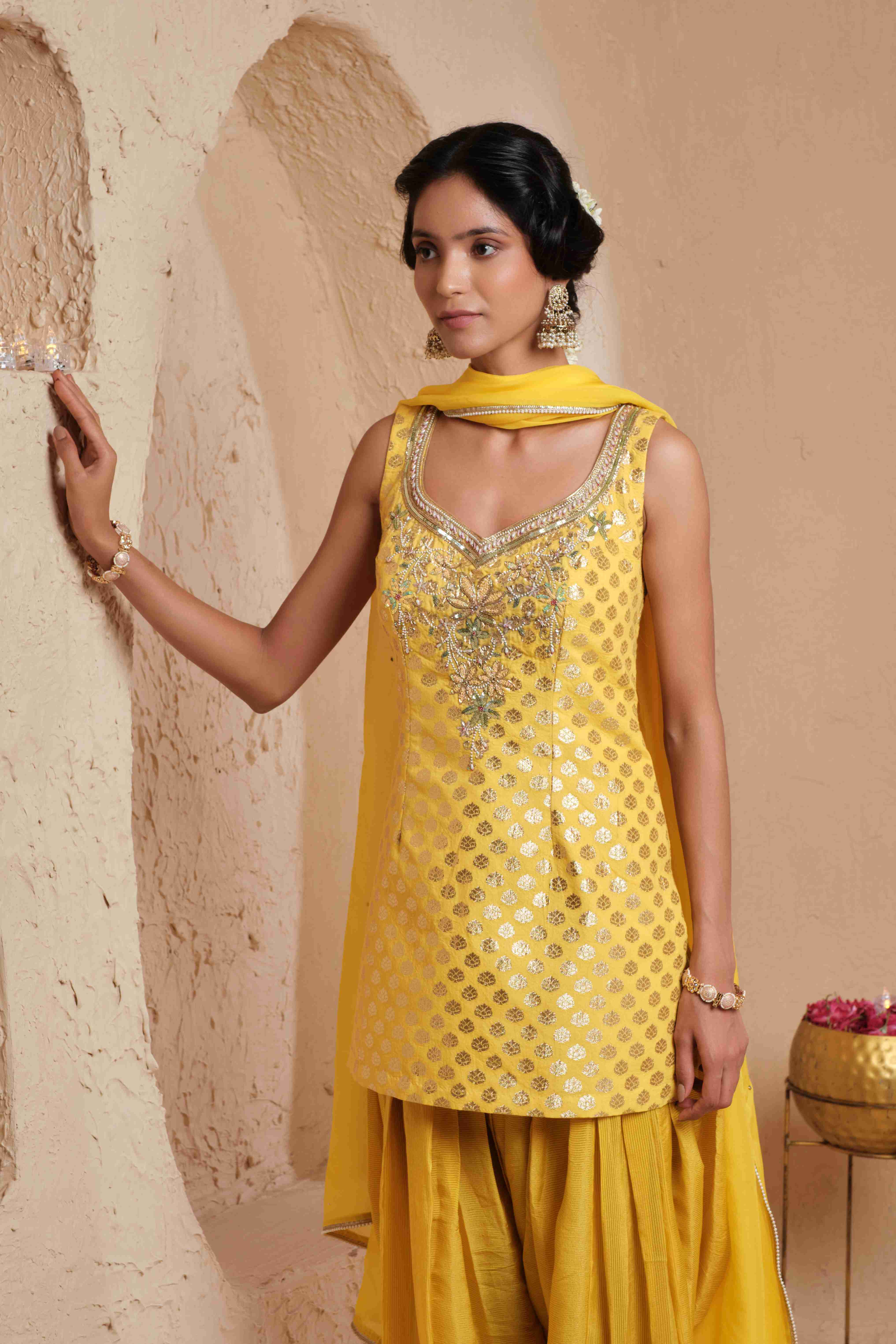 A model showcasing Hiranya Mustard Yellow Kurta Set by Muditaa By Urmila from Muditaa By Urmila's collection