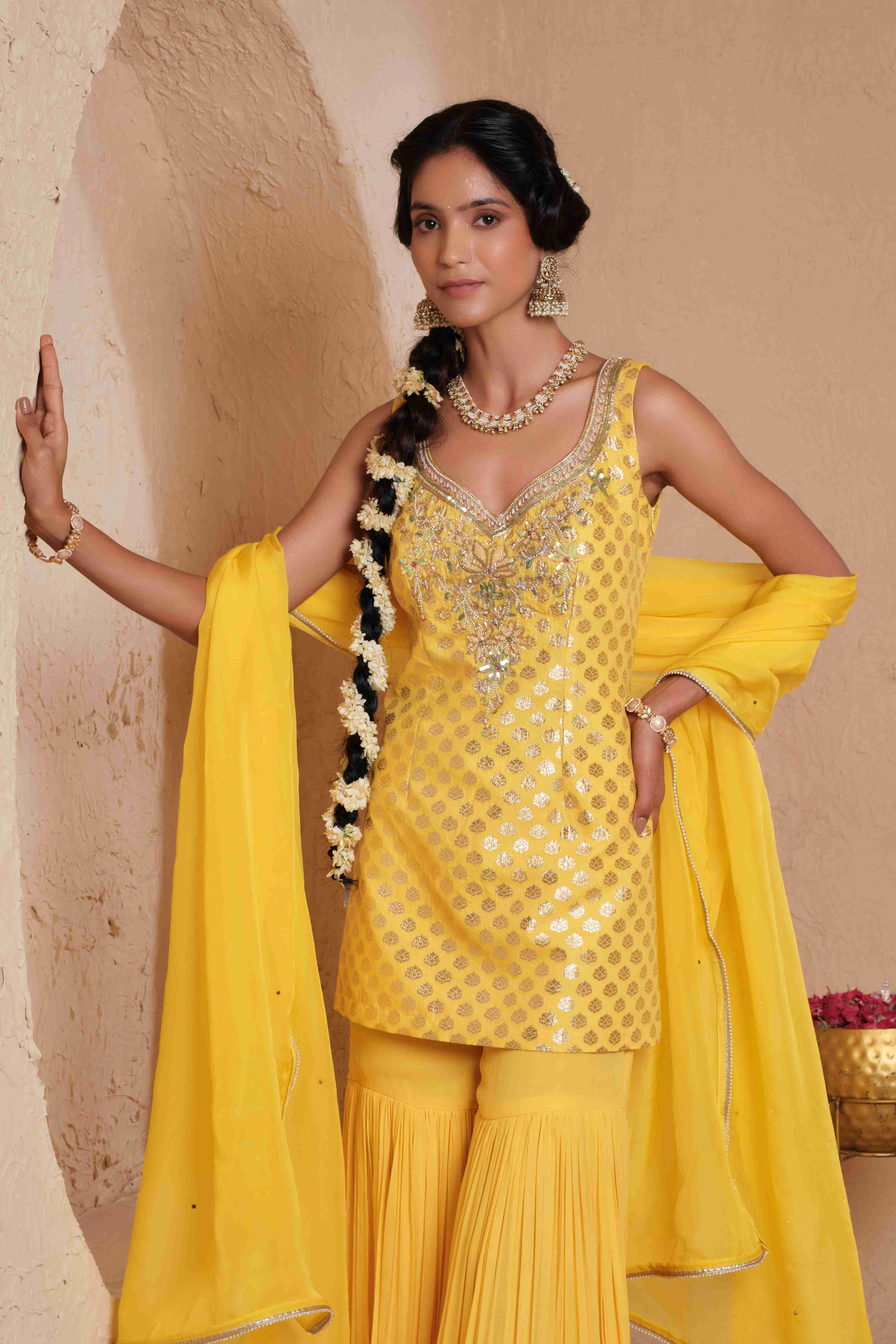 A model showcasing Tejasvi Chanderi Brocade Garara Set by Muditaa By Urmila from Muditaa By Urmila's collection