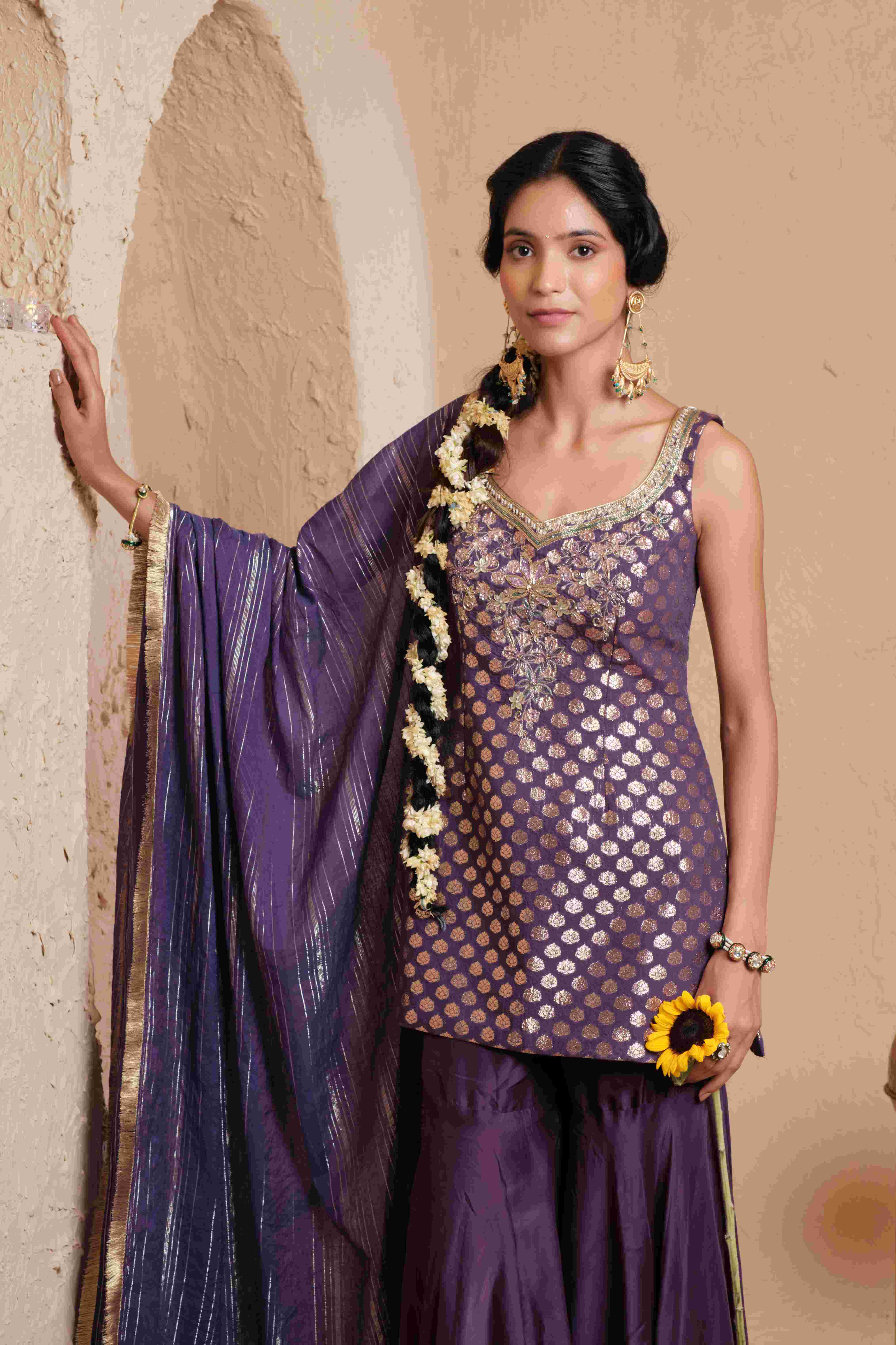 A model showcasing Vanya Deep Violet Garara Set by Muditaa By Urmila from Muditaa By Urmila's collection