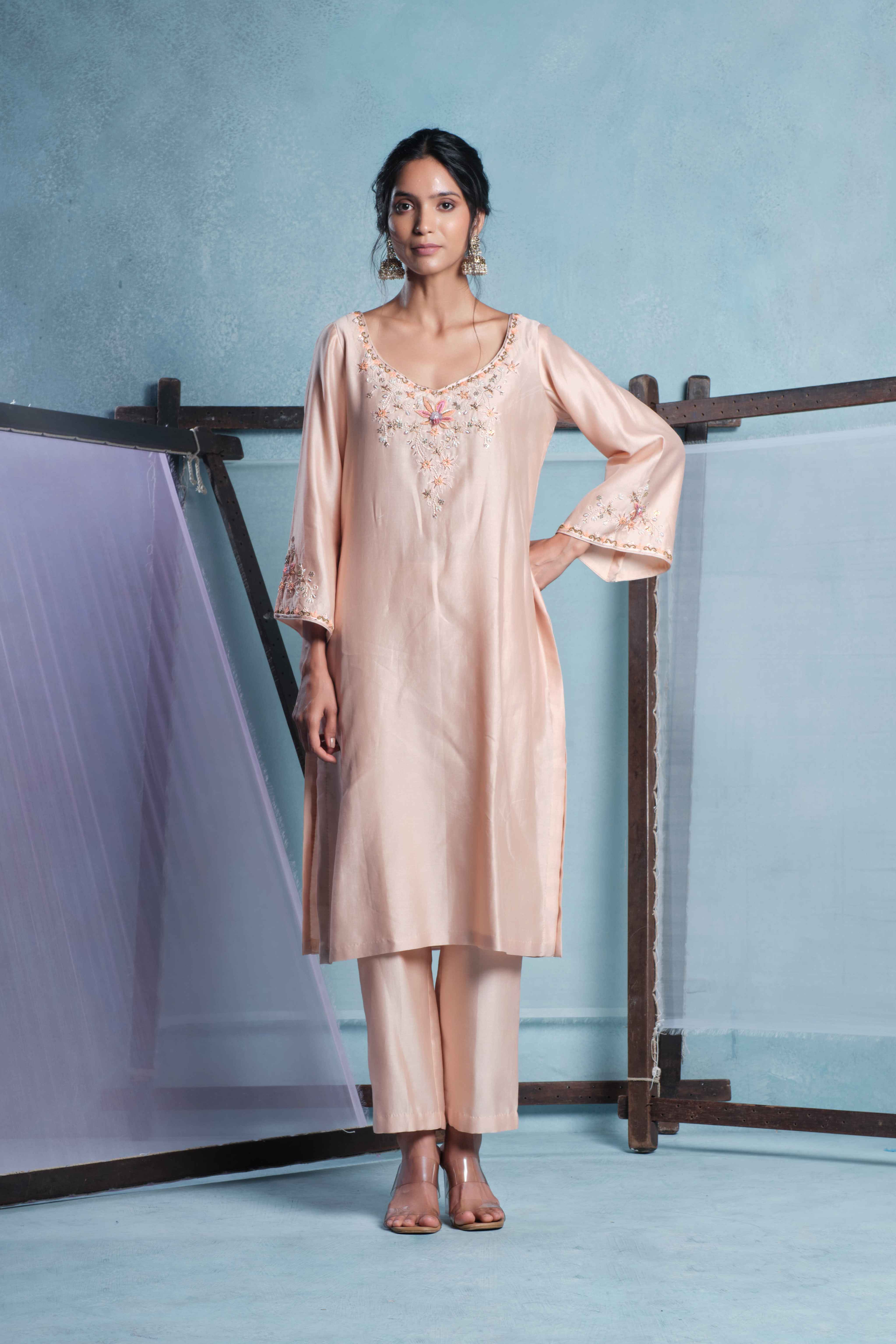 A model showcasing Amaya Peach Pants Set by Muditaa By Urmila from Muditaa By Urmila's collection