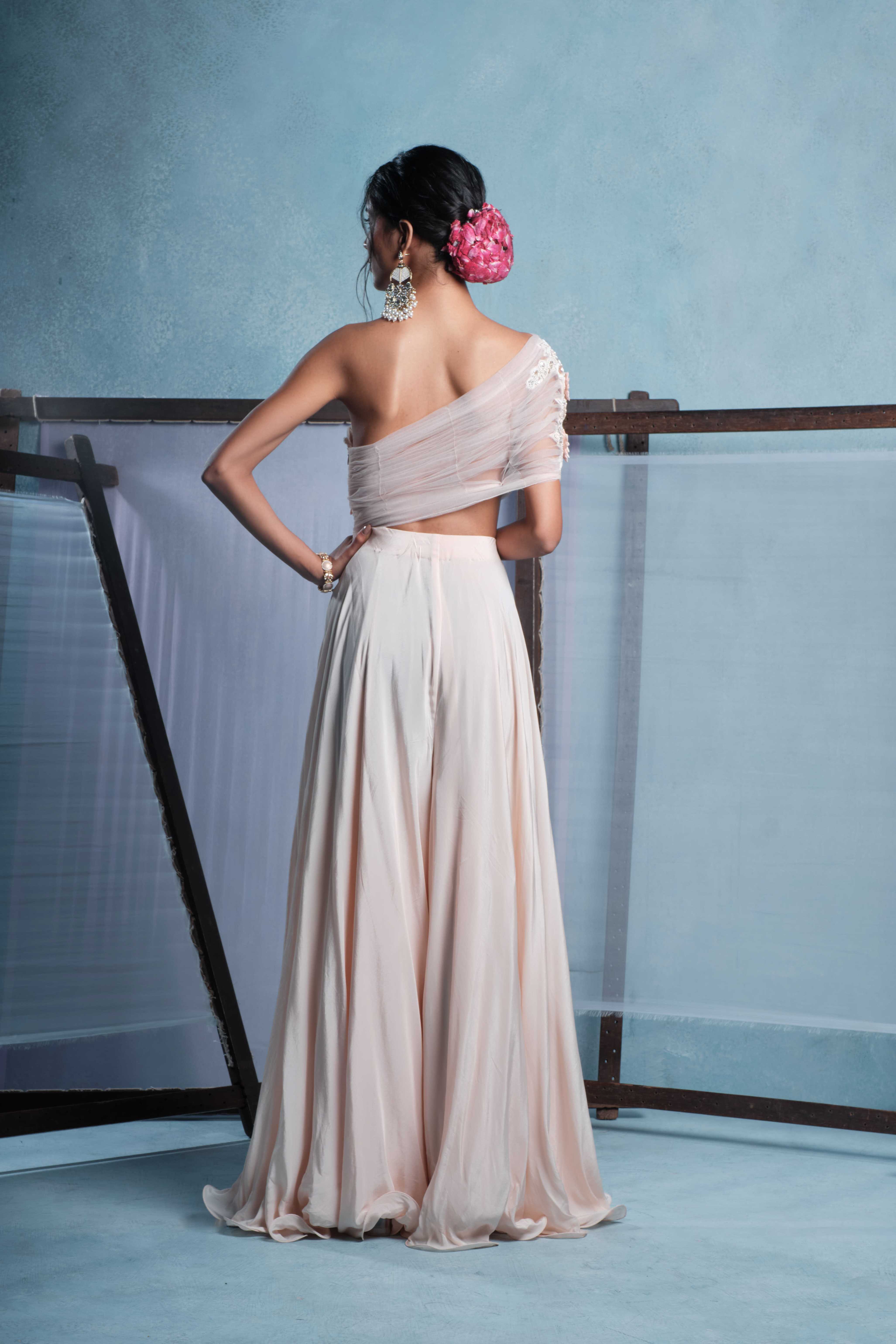 A model showcasing Kaya Blush Pink Jumpsuit by Muditaa By Urmila from Muditaa By Urmila's collection