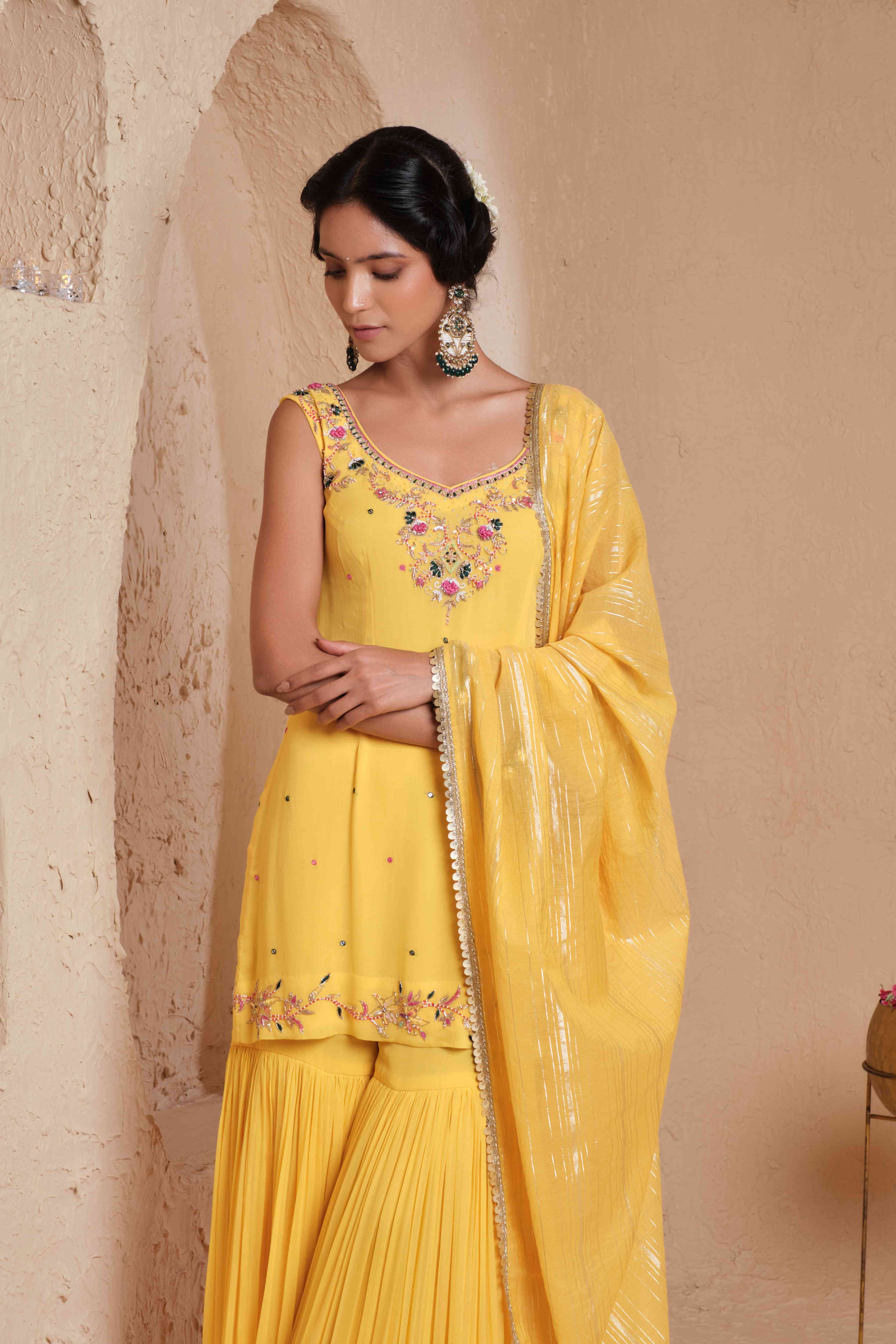 A model showcasing Dharvi Mustard Yellow Garara Set by Muditaa By Urmila from Muditaa By Urmila's collection