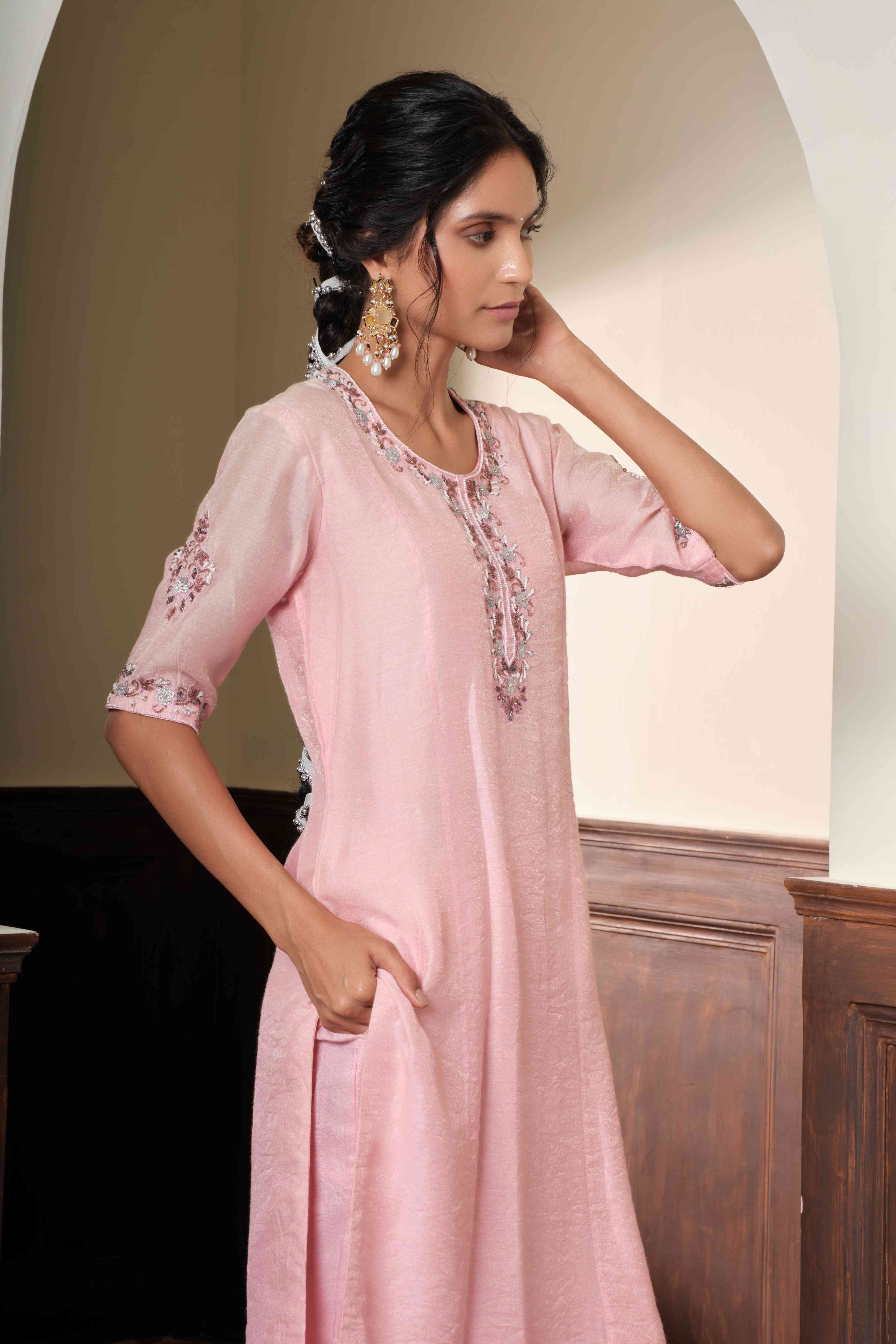 A model showcasing Meera Blush Pink Pants Set by Muditaa By Urmila from Muditaa By Urmila's collection