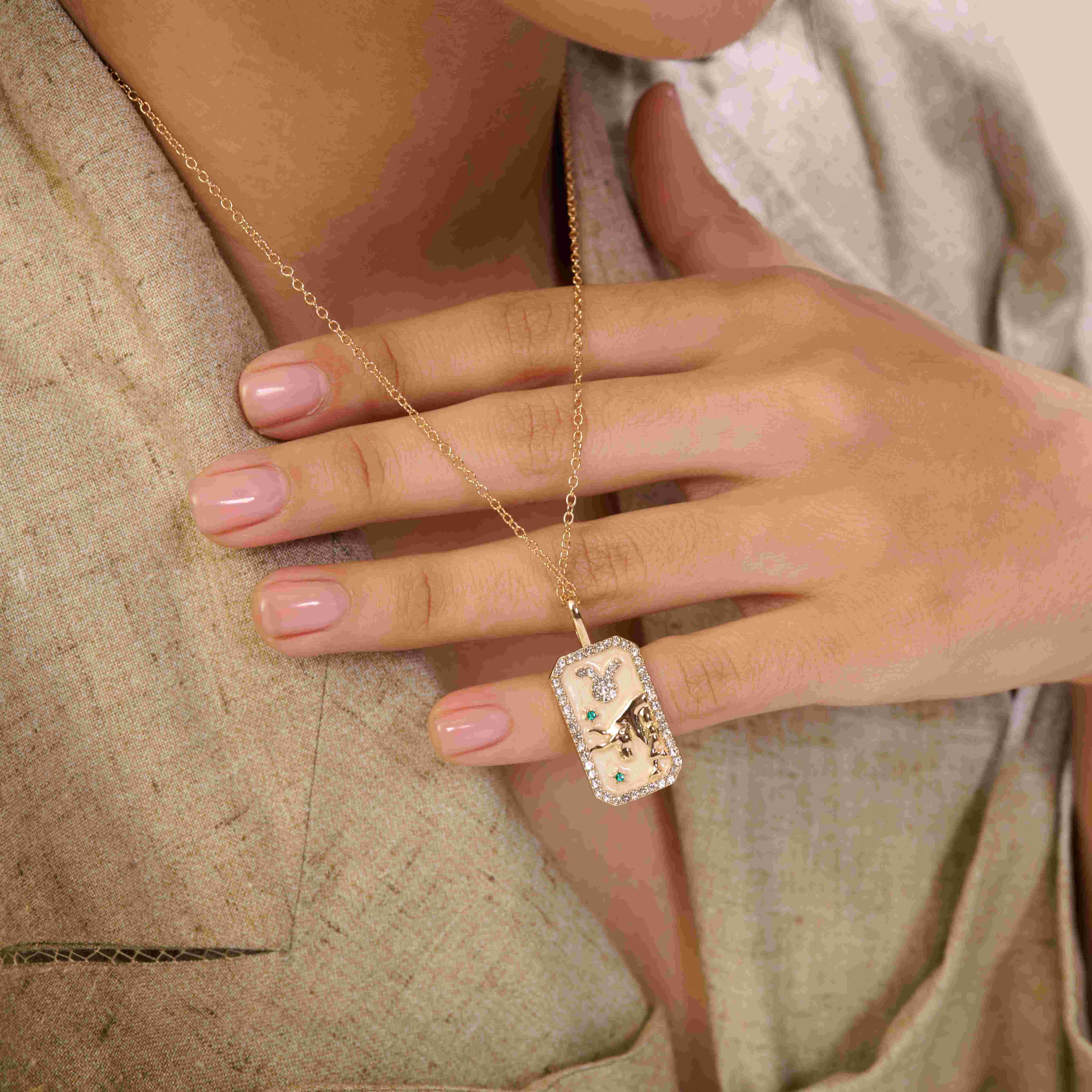 A model showcasing Taurus Zodiac Pendant by Dusala from Dusala's collection A model showcasing Taurus Zodiac Pendant by Dusala from Dusala's collection