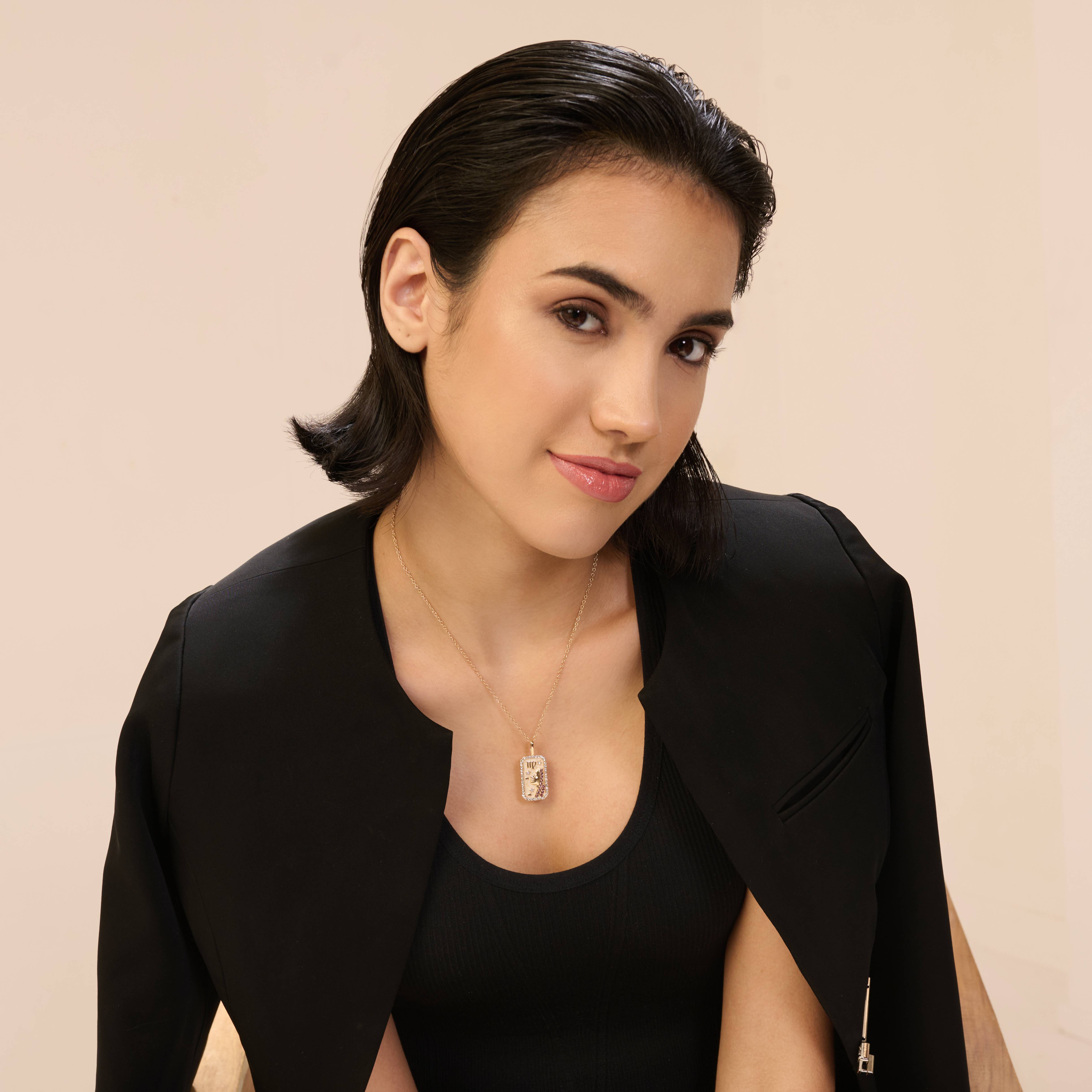 A model showcasing Virgo Zodiac Pendant by Dusala from Dusala's collection