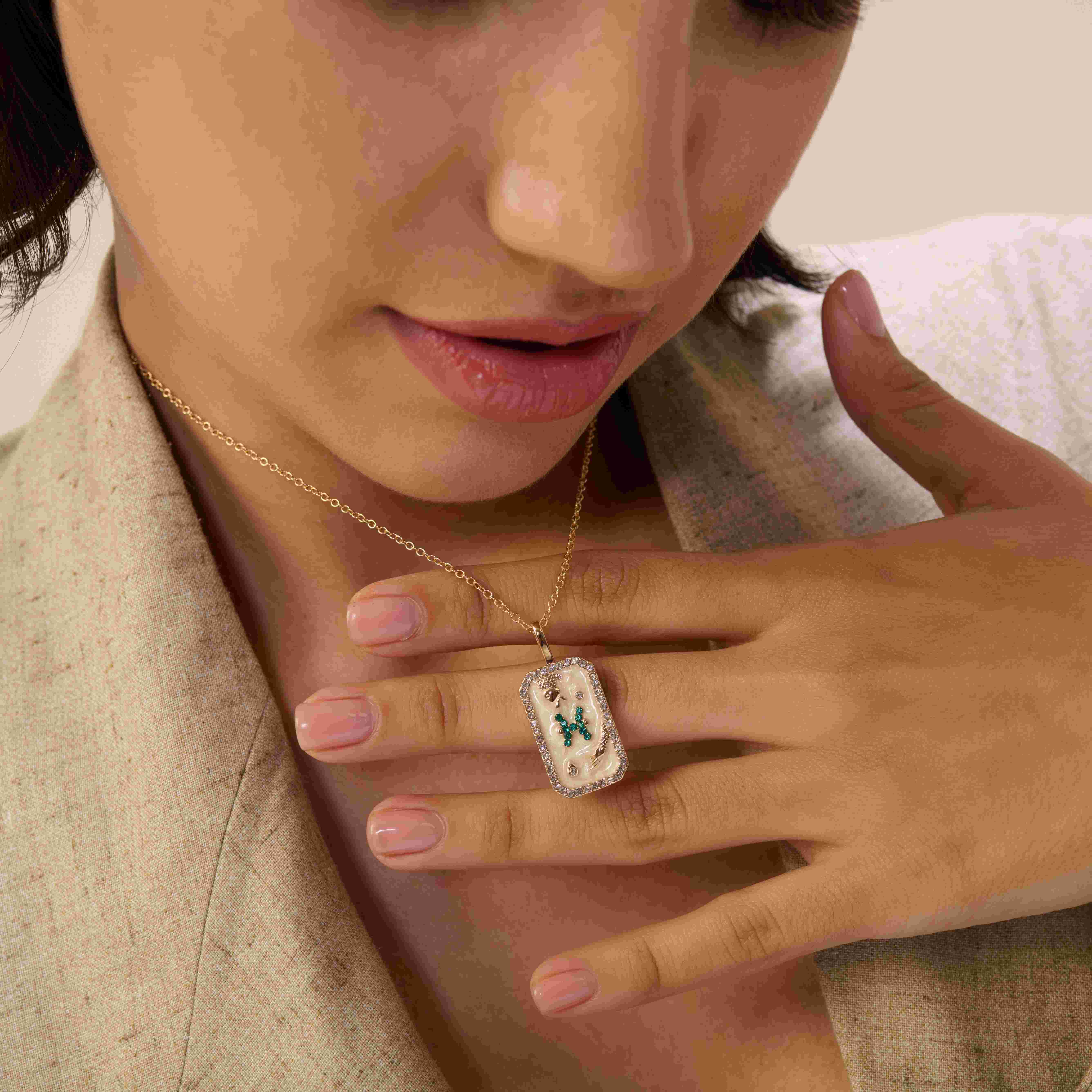 A model showcasing Pisces Zodiac Pendant by Dusala from Dusala's collection A model showcasing Pisces Zodiac Pendant by Dusala from Dusala's collection