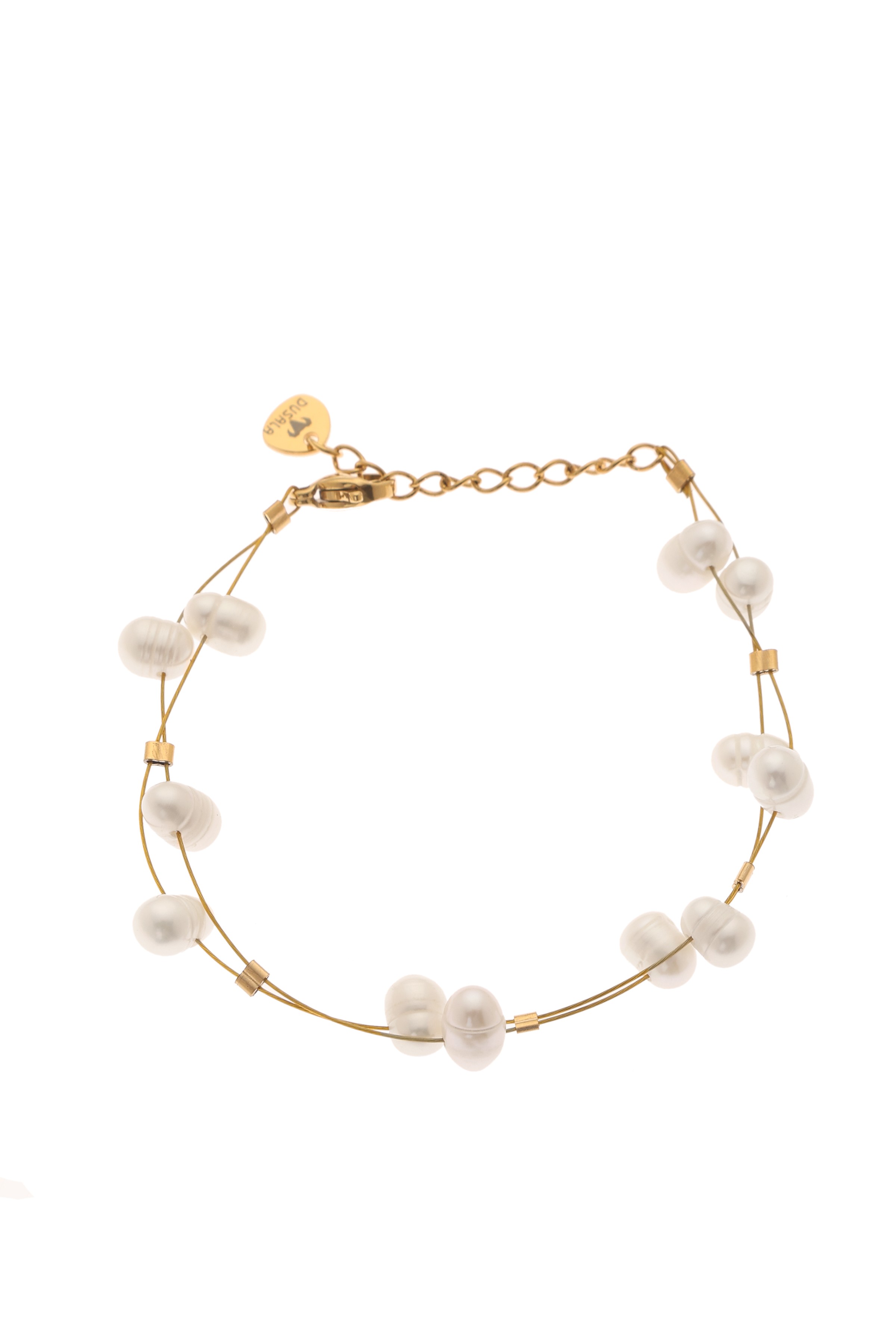 A model showcasing Pearl Elegance Bracelet by Dusala from Dusala's collection A model showcasing Pearl Elegance Bracelet by Dusala from Dusala's collection