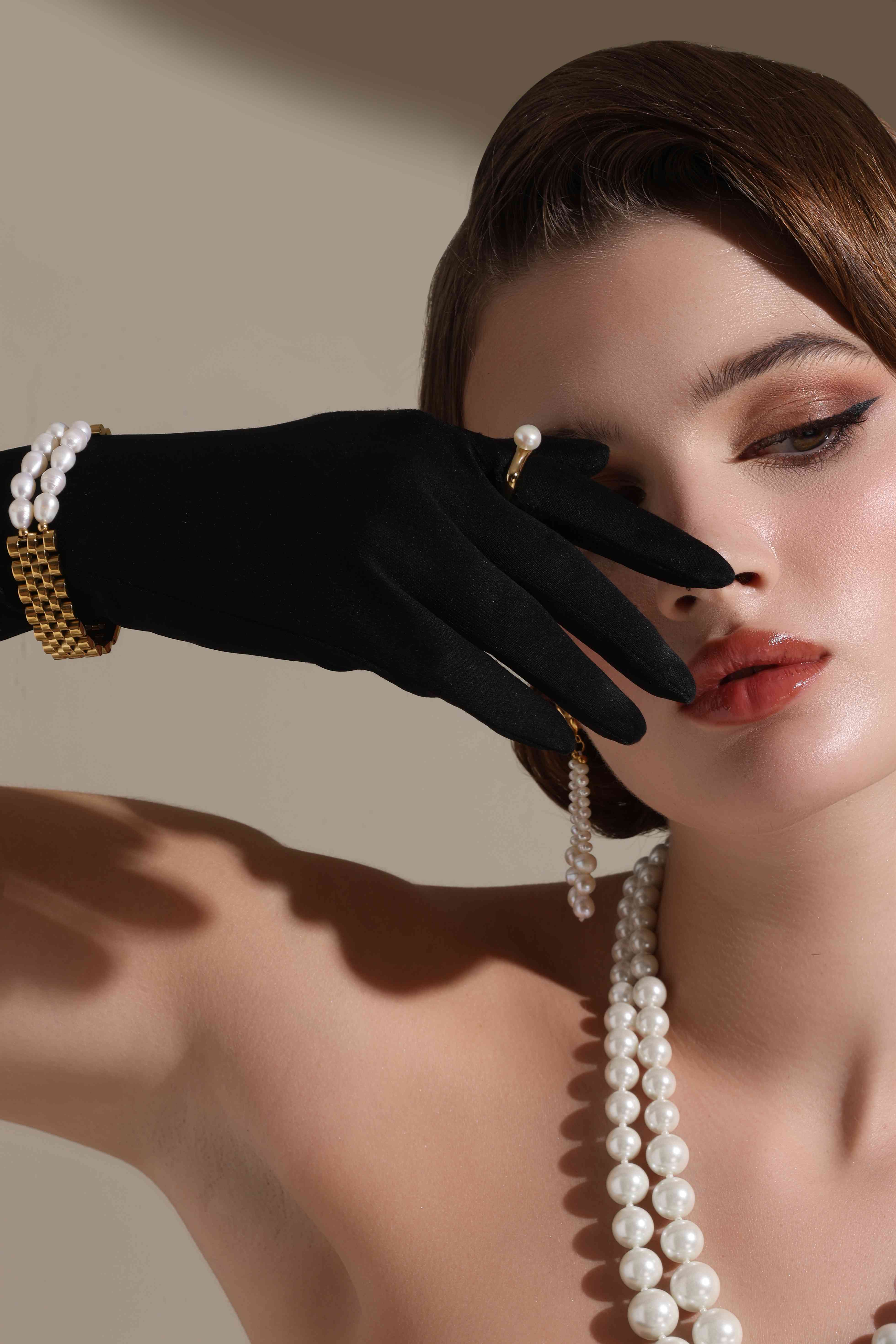 A model showcasing Cuban Luxe Bracelet by Dusala from Dusala's collection A model showcasing Cuban Luxe Bracelet by Dusala from Dusala's collection