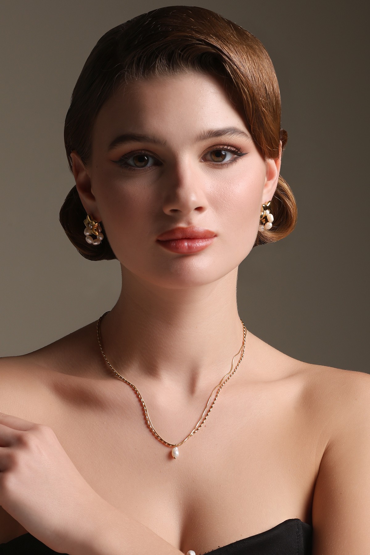 A model showcasing Double Delight Pendant by Dusala from Dusala's collection A model showcasing Double Delight Pendant by Dusala from Dusala's collection