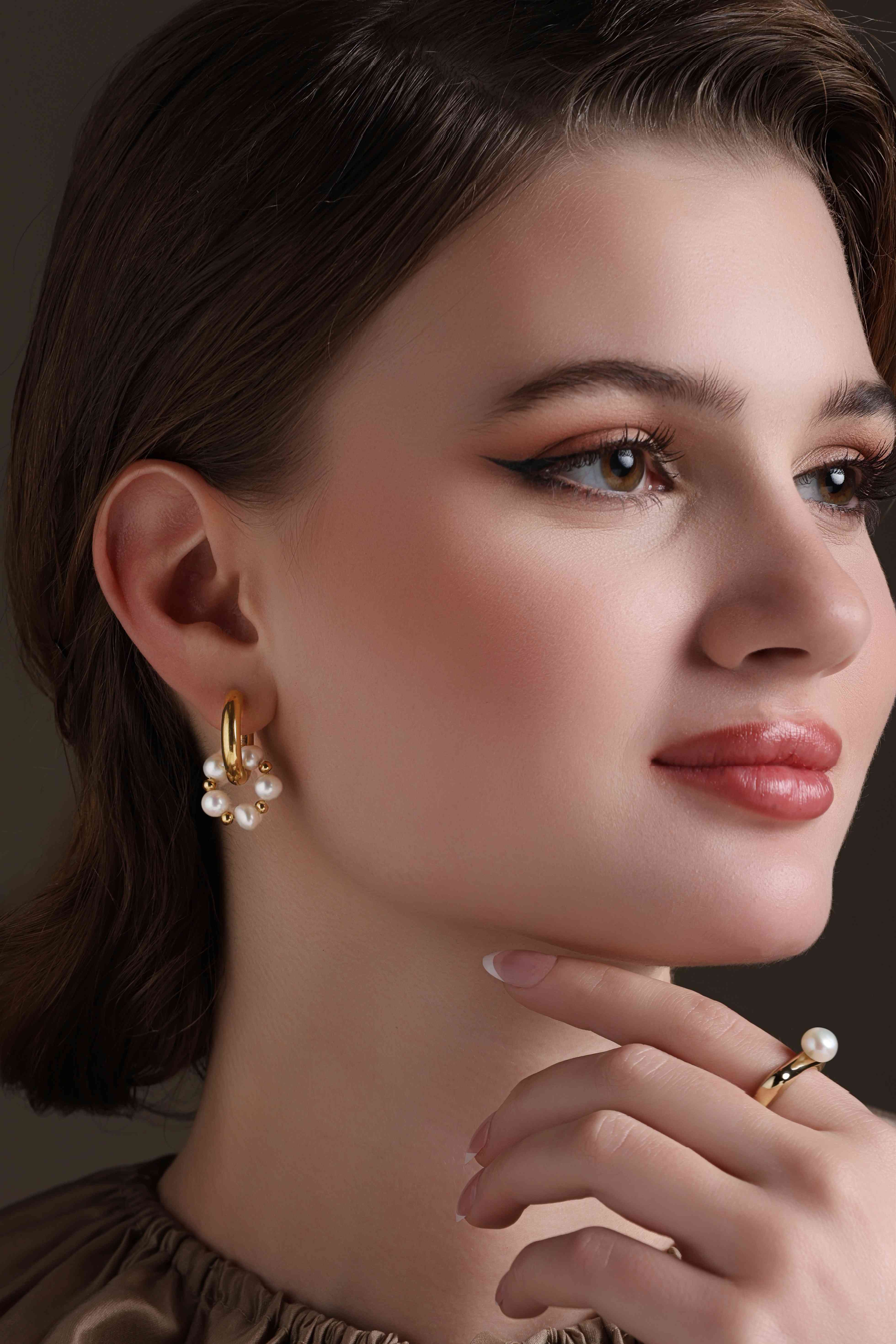 A model showcasing Huggie Trend Earrings Feature image by Dusala from Dusala's collection