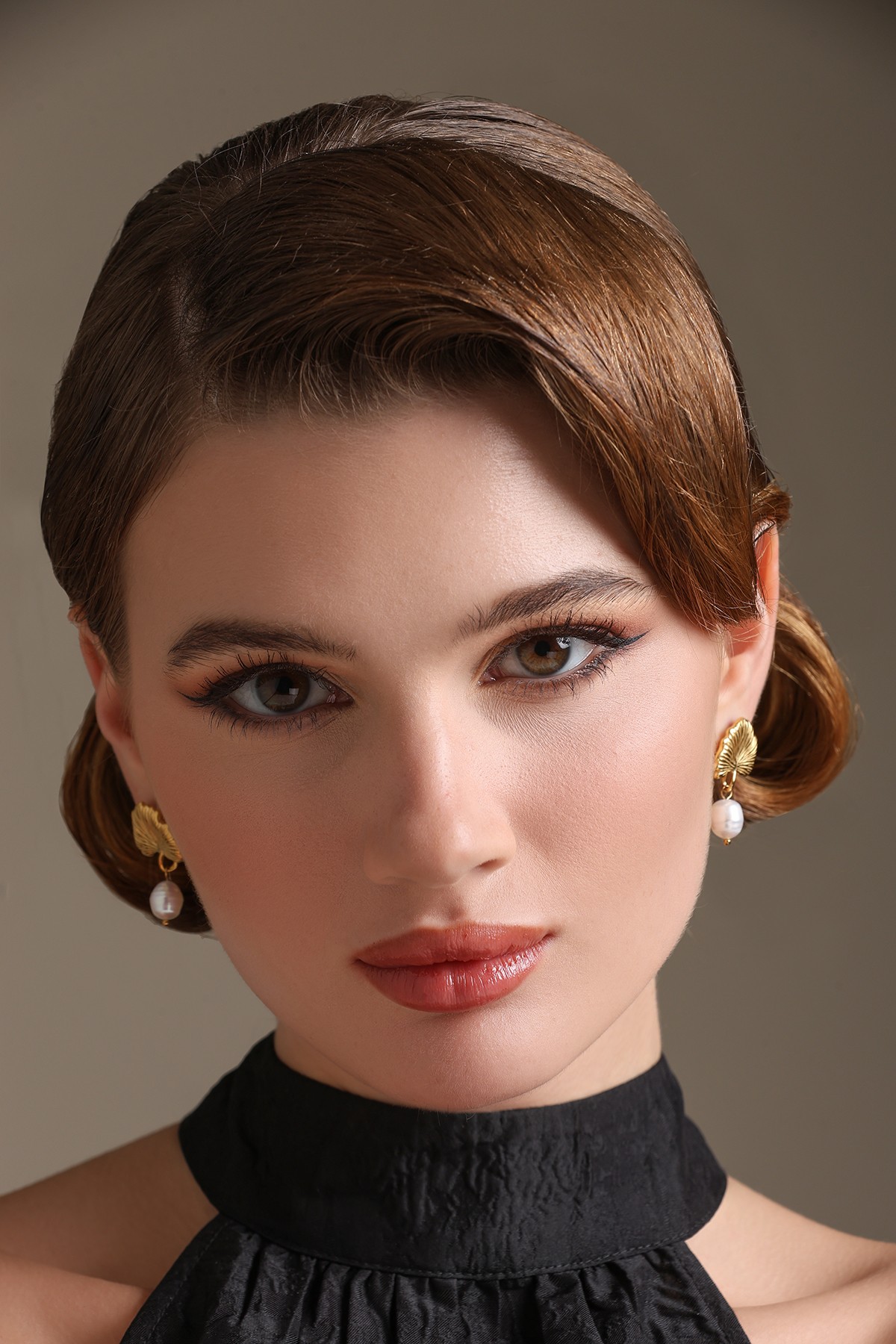 A model showcasing Natures Touch Earrings by Dusala from Dusala's collection A model showcasing Natures Touch Earrings by Dusala from Dusala's collection
