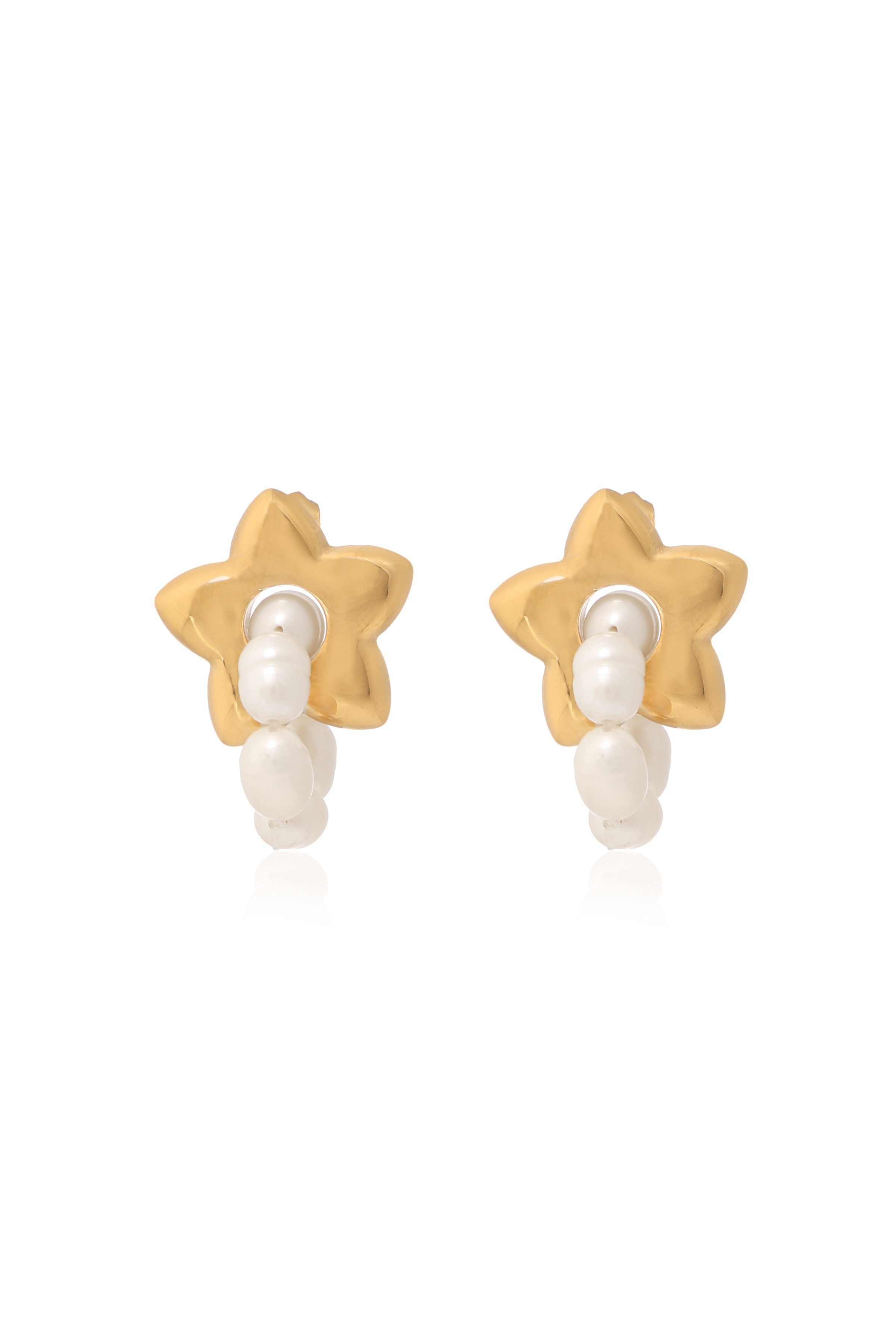 A model showcasing Starry Golden Luxe Earrings by Dusala from Dusala's collection A model showcasing Starry Golden Luxe Earrings by Dusala from Dusala's collection