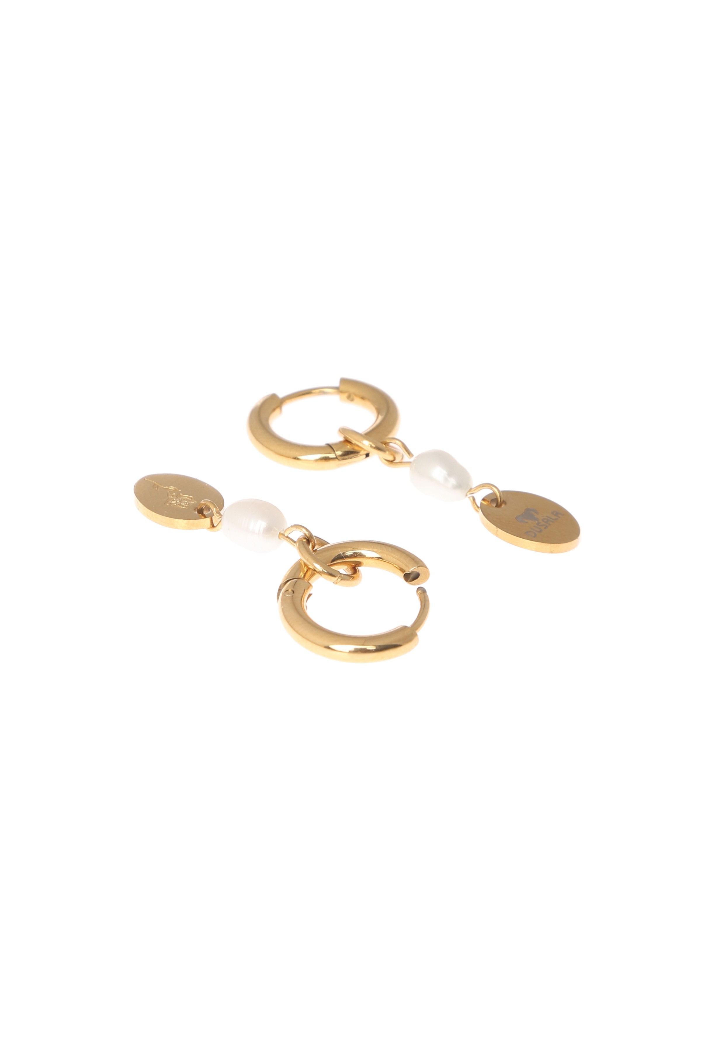 A model showcasing Flora Drop Golden Earrings by Dusala from Dusala's collection A model showcasing Flora Drop Golden Earrings by Dusala from Dusala's collection