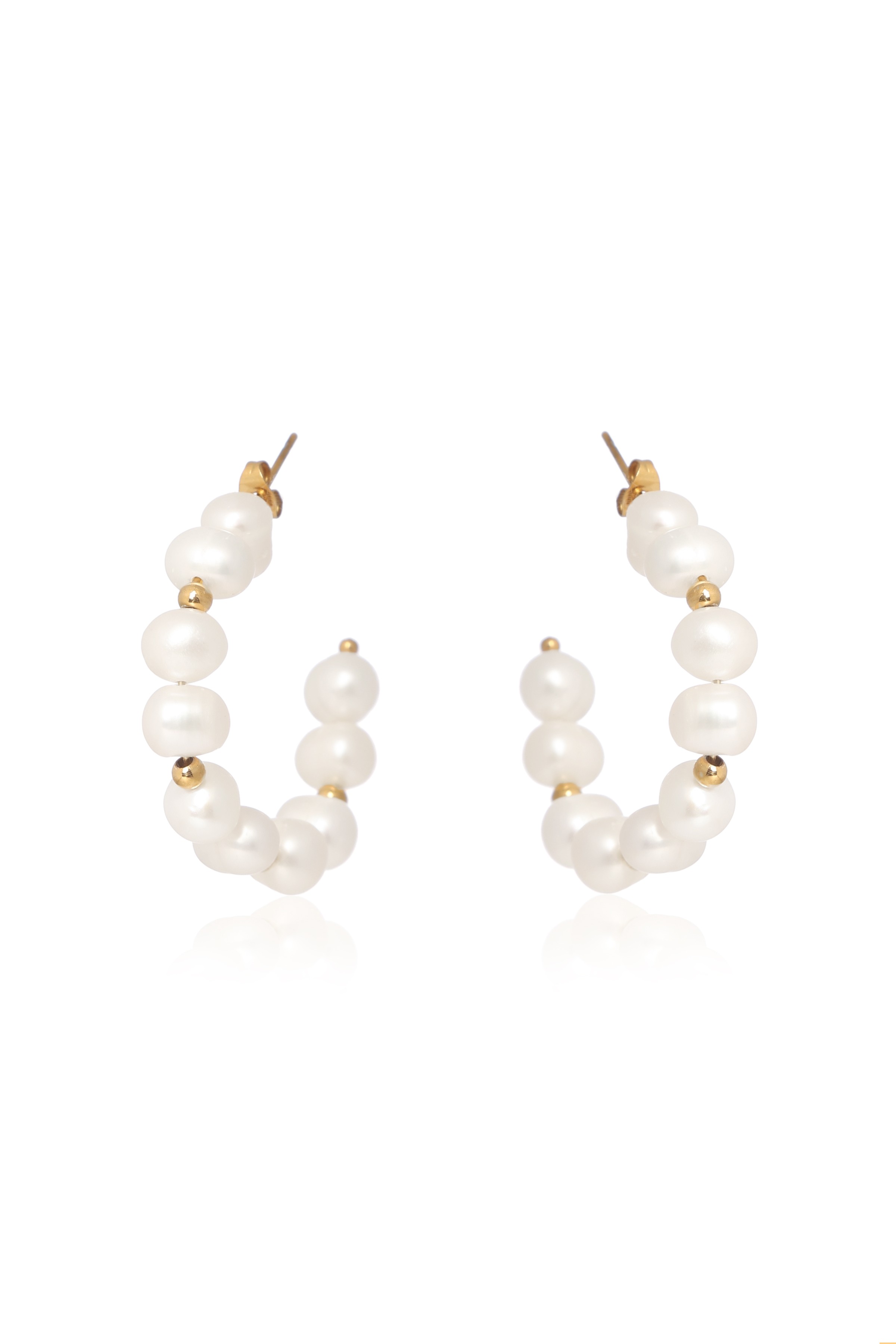A model showcasing Irregular Beauty Earrings by Dusala from Dusala's collection A model showcasing Irregular Beauty Earrings by Dusala from Dusala's collection