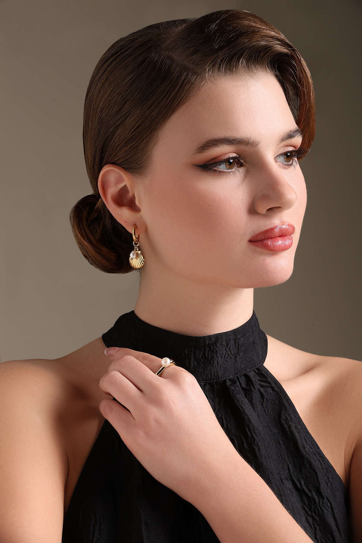 A model showcasing Ocean Vibe Earrings by Dusala from Dusala's collection A model showcasing Ocean Vibe Earrings by Dusala from Dusala's collection