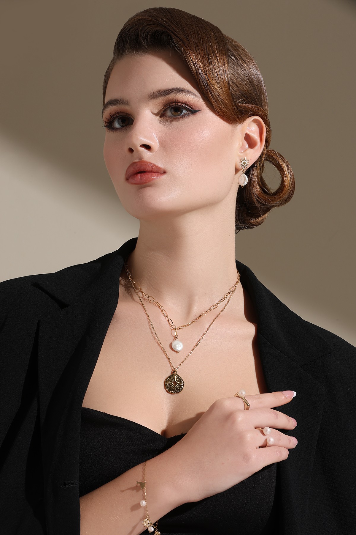 A model showcasing Golden Charm Pendant by Dusala from Dusala's collection A model showcasing Golden Charm Pendant by Dusala from Dusala's collection