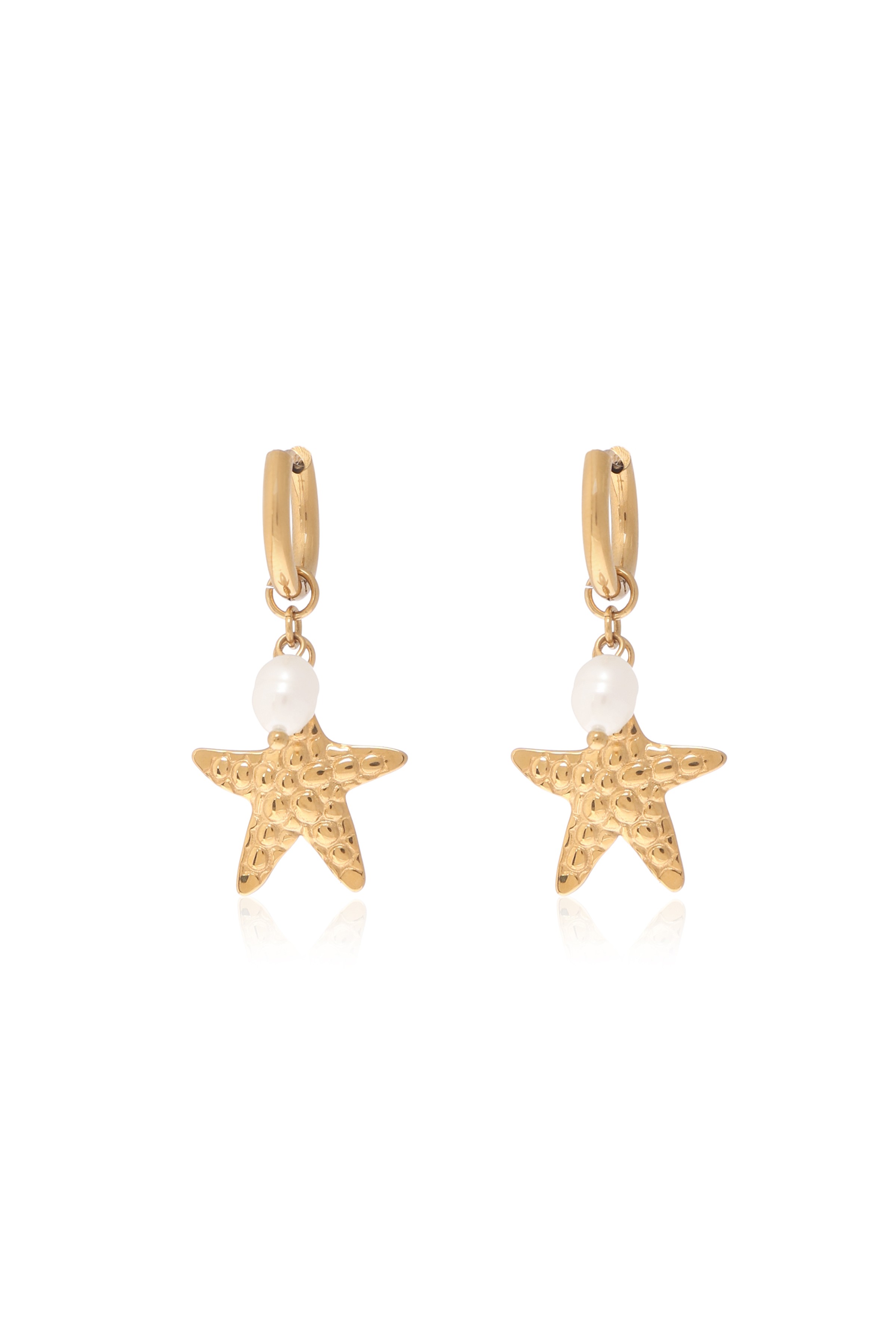 A model showcasing Ocean Star Earrings by Dusala from Dusala's collection A model showcasing Ocean Star Earrings by Dusala from Dusala's collection