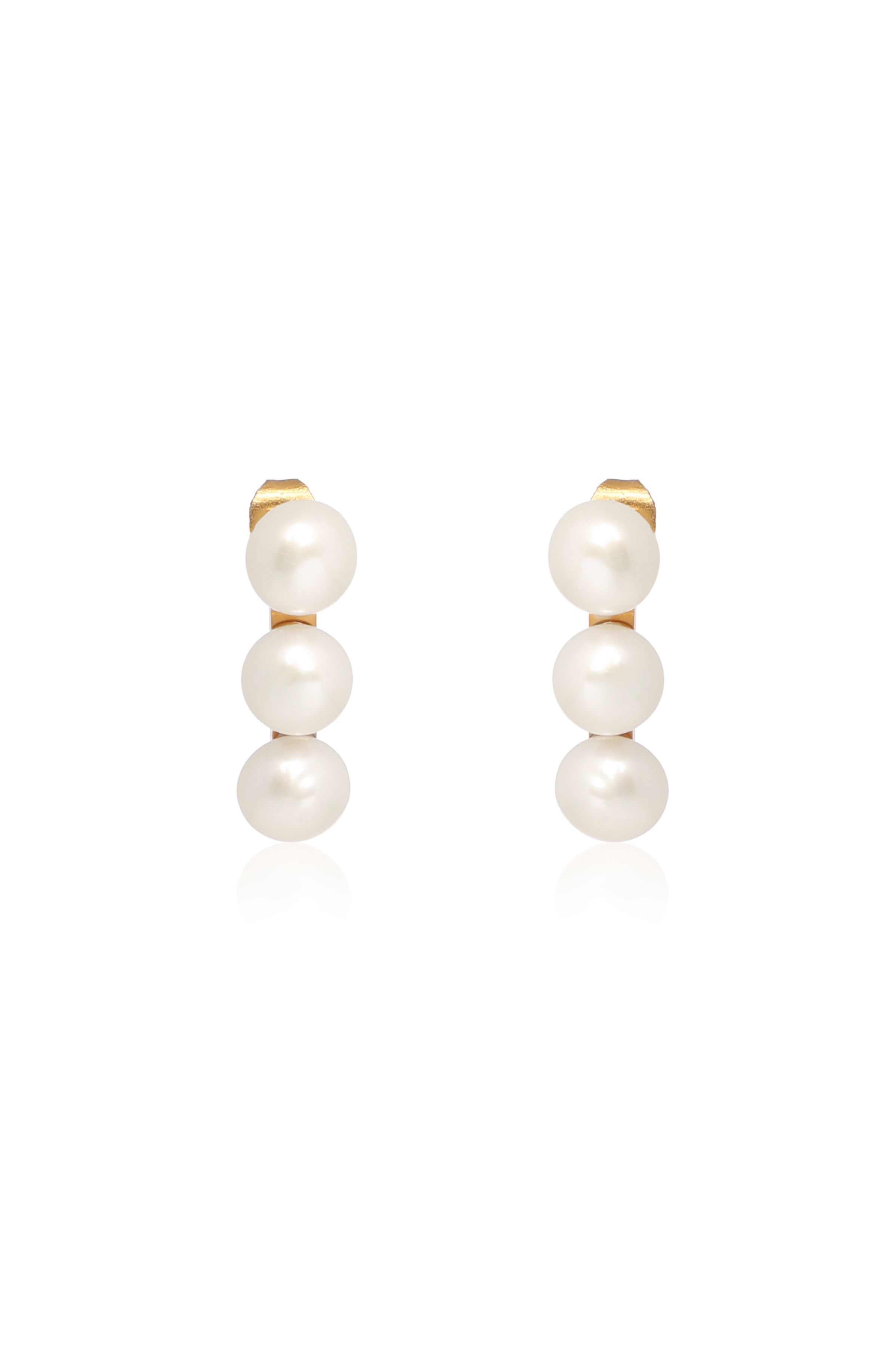 A model showcasing Chic Studs Earrings by Dusala from Dusala's collection A model showcasing Chic Studs Earrings by Dusala from Dusala's collection