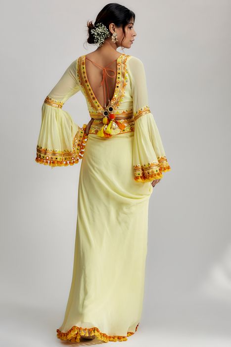 A model showcasing Naira Drape Skirt Set In Yellow by Gopi Vaid from Gopi Vaid's collection