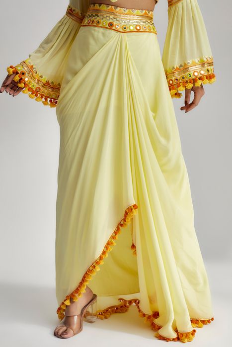 A model showcasing Naira Drape Skirt Set In Yellow by Gopi Vaid from Gopi Vaid's collection