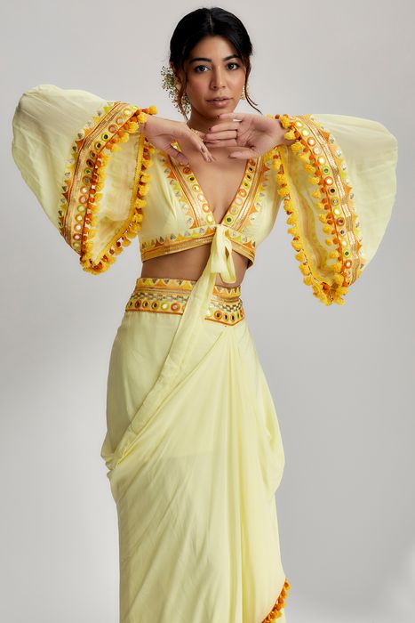 A model showcasing Naira Drape Skirt Set In Yellow by Gopi Vaid from Gopi Vaid's collection