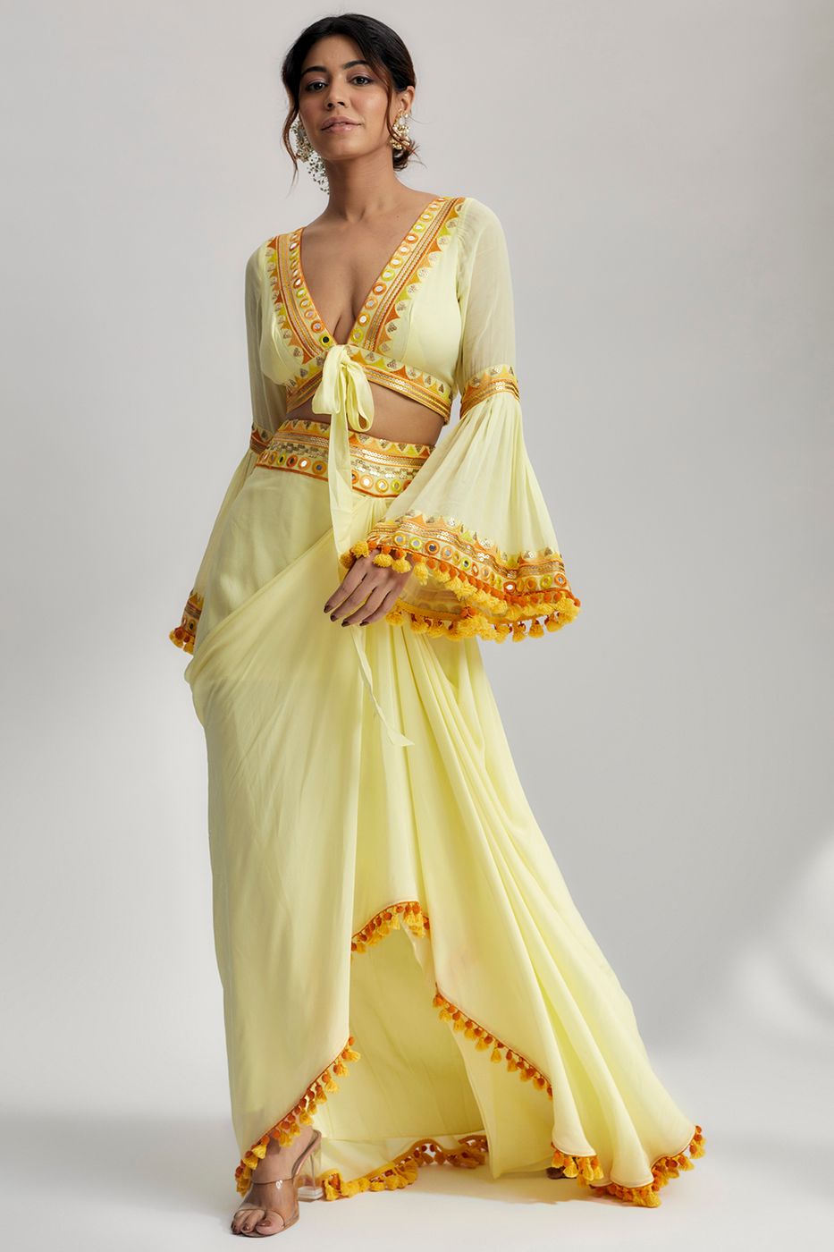 A model showcasing Naira Drape Skirt Set In Yellow Feature image by Gopi Vaid from Gopi Vaid's collection